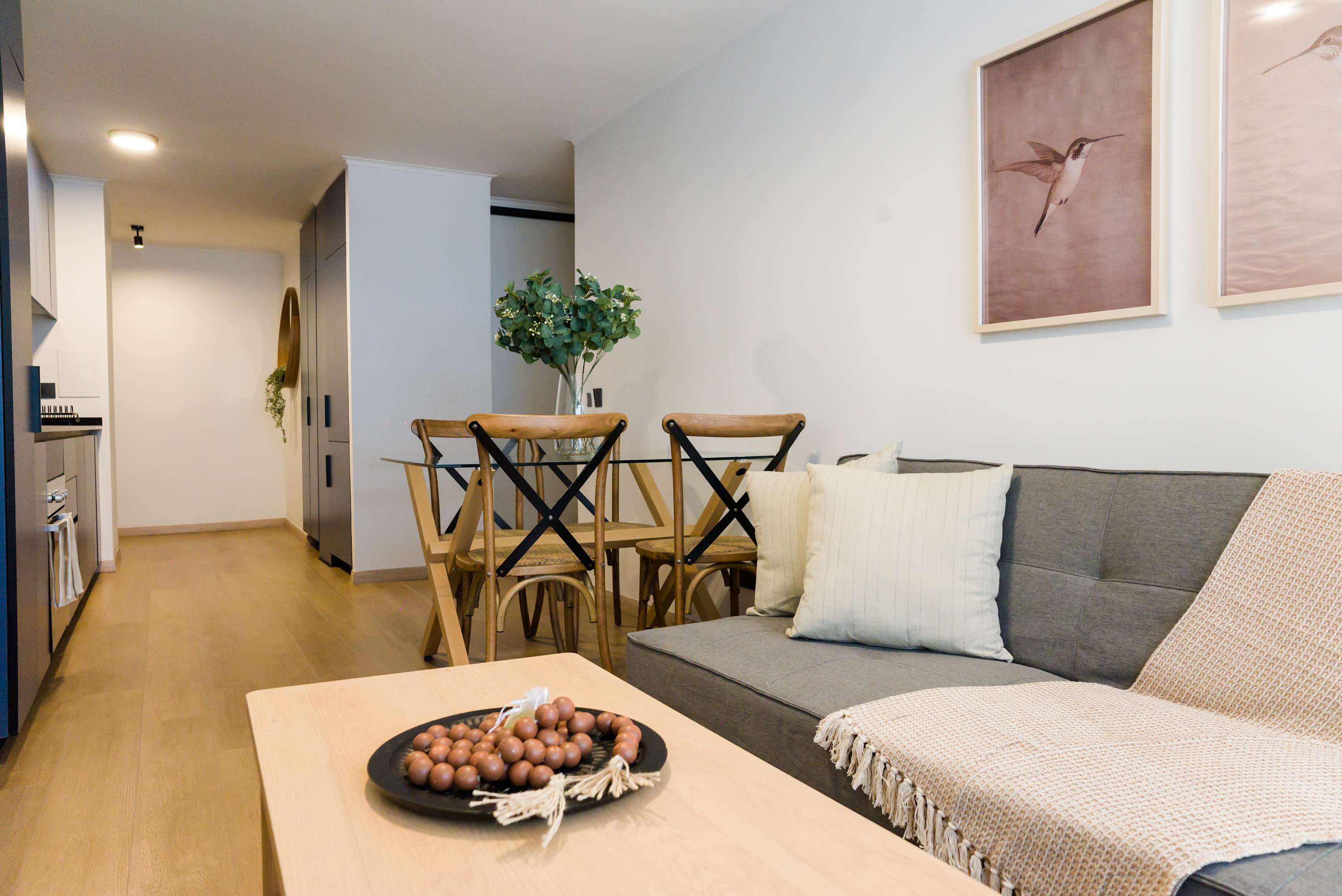 Unwind in this stylish living area with cozy seating and elegant decor, perfect for relaxing after a day of exploring.