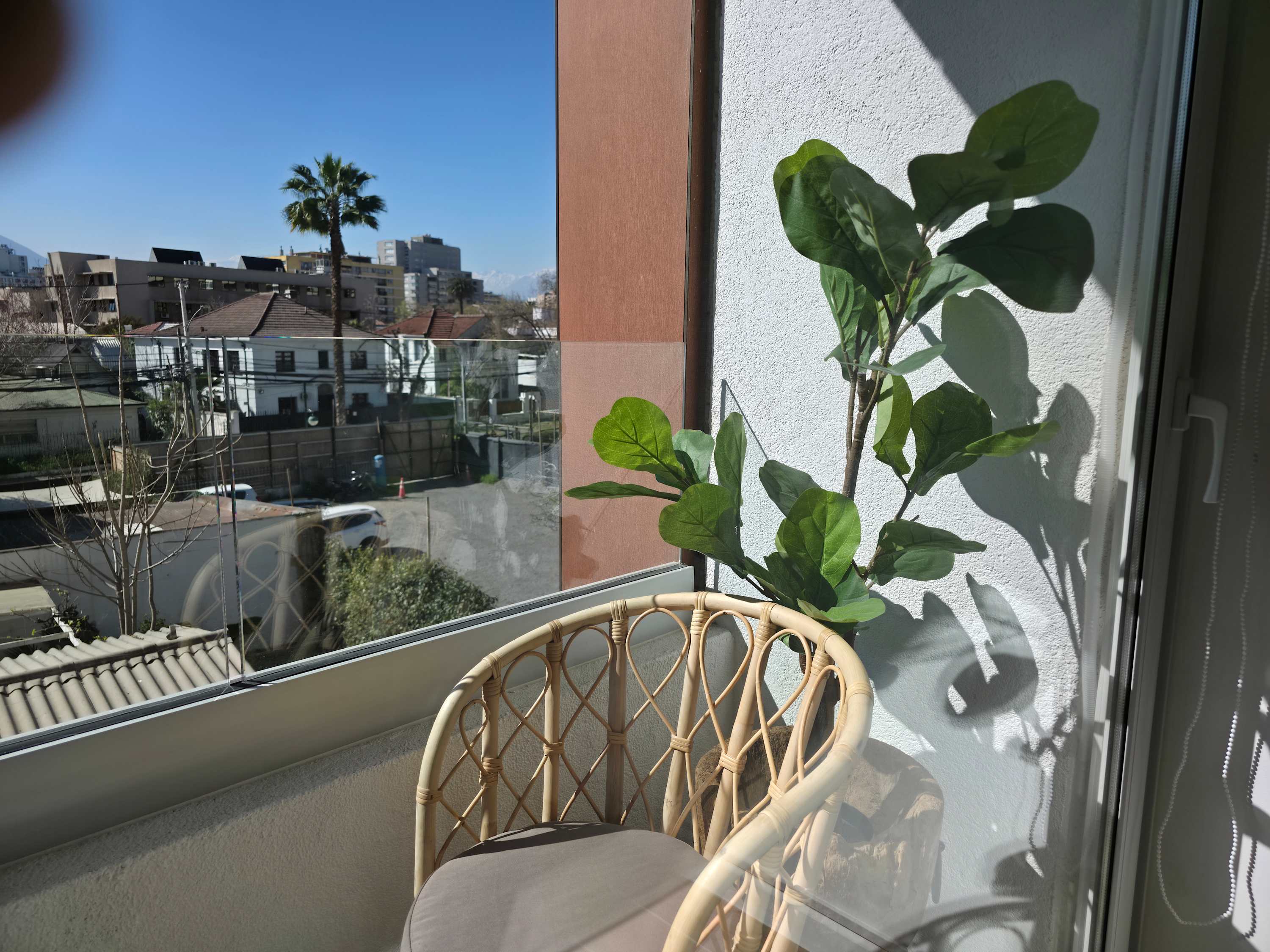 Enjoy serene mountain views from this cozy balcony, perfect for relaxing with a morning coffee.