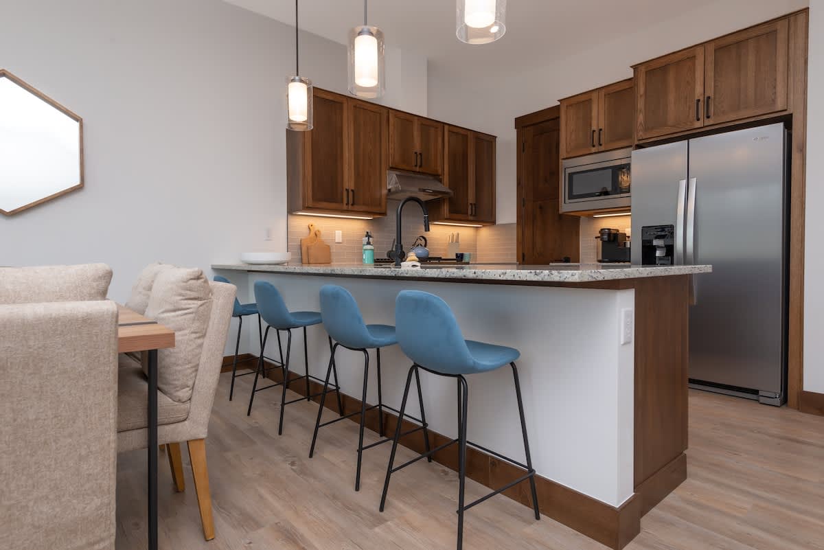 Our fully equipped kitchen has everything you need to whip up a feast. Enjoy spacious countertops, modern appliances, and a beautiful island with seating.