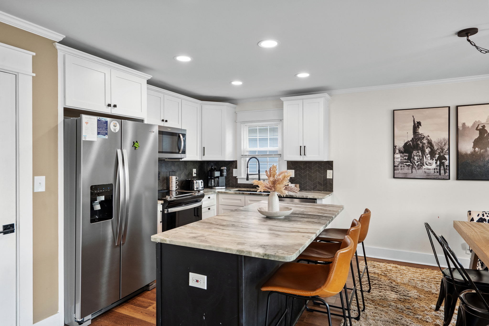 Kitchen area with island and seating.
