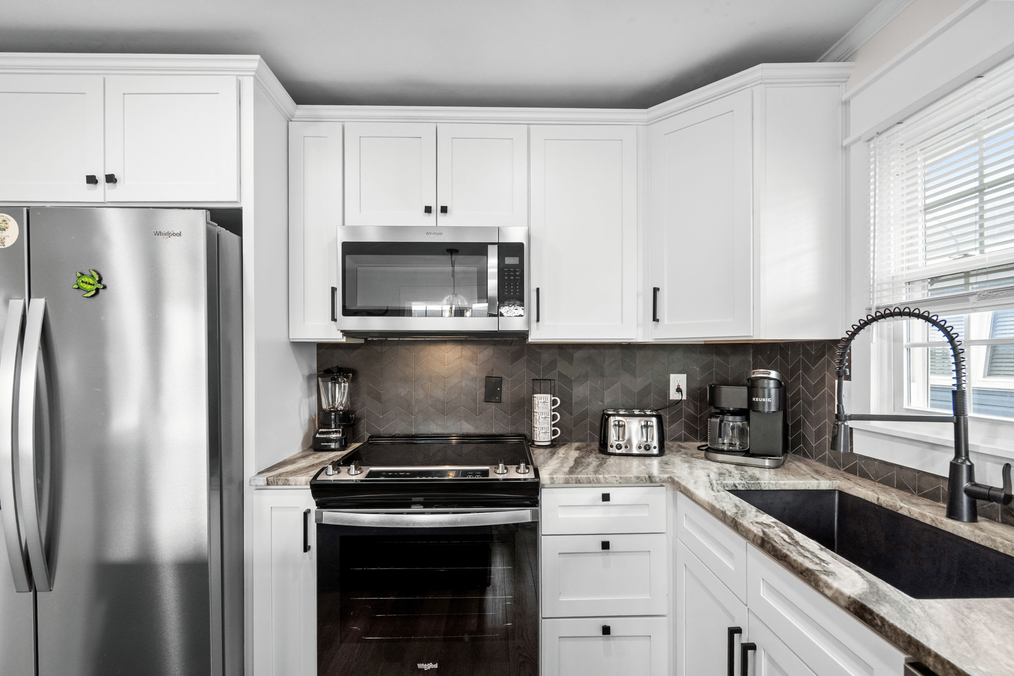 Kitchen featuring essential appliances.