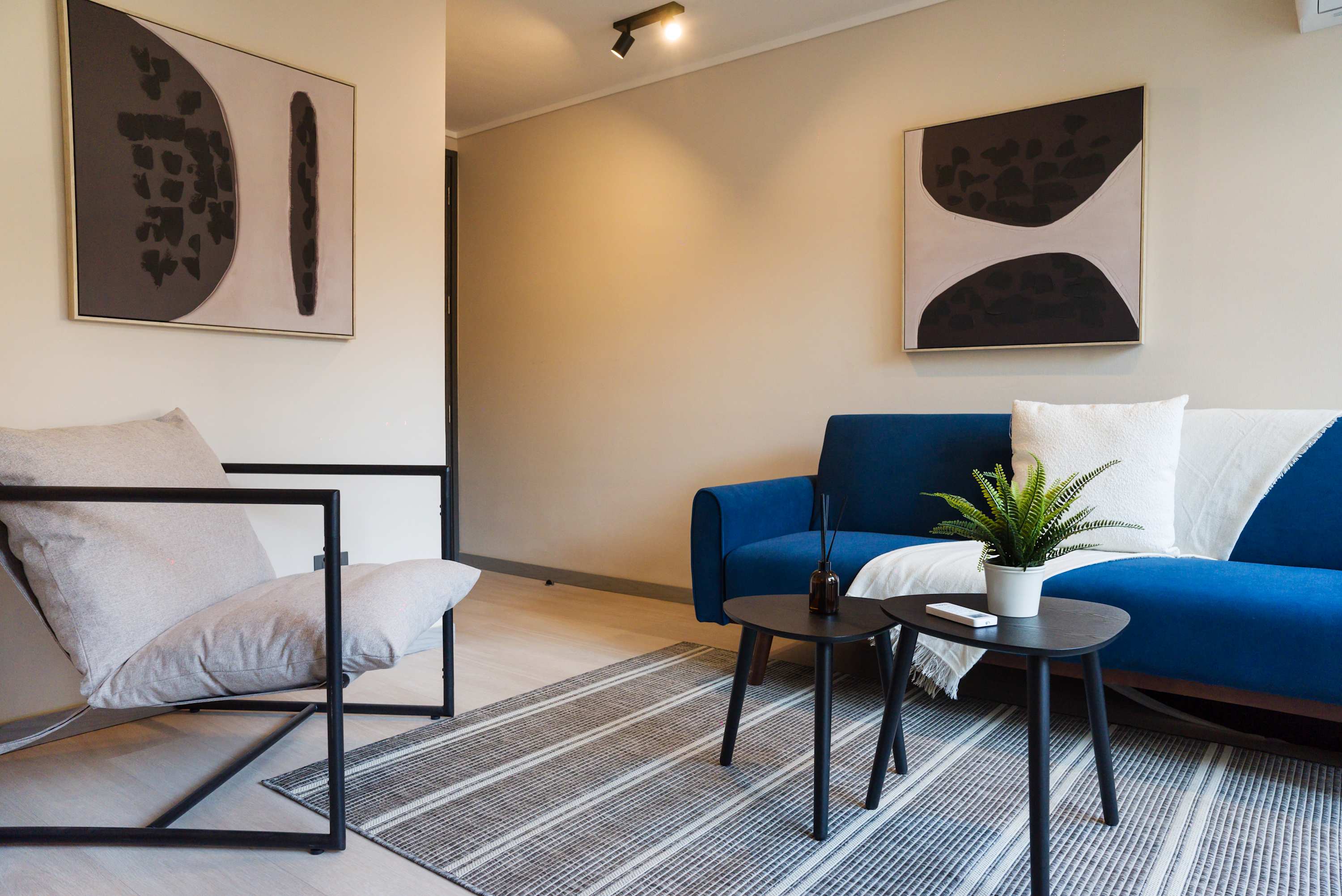 Relax in this stylish living area with modern decor and a cozy atmosphere, perfect for unwinding after exploring the city.