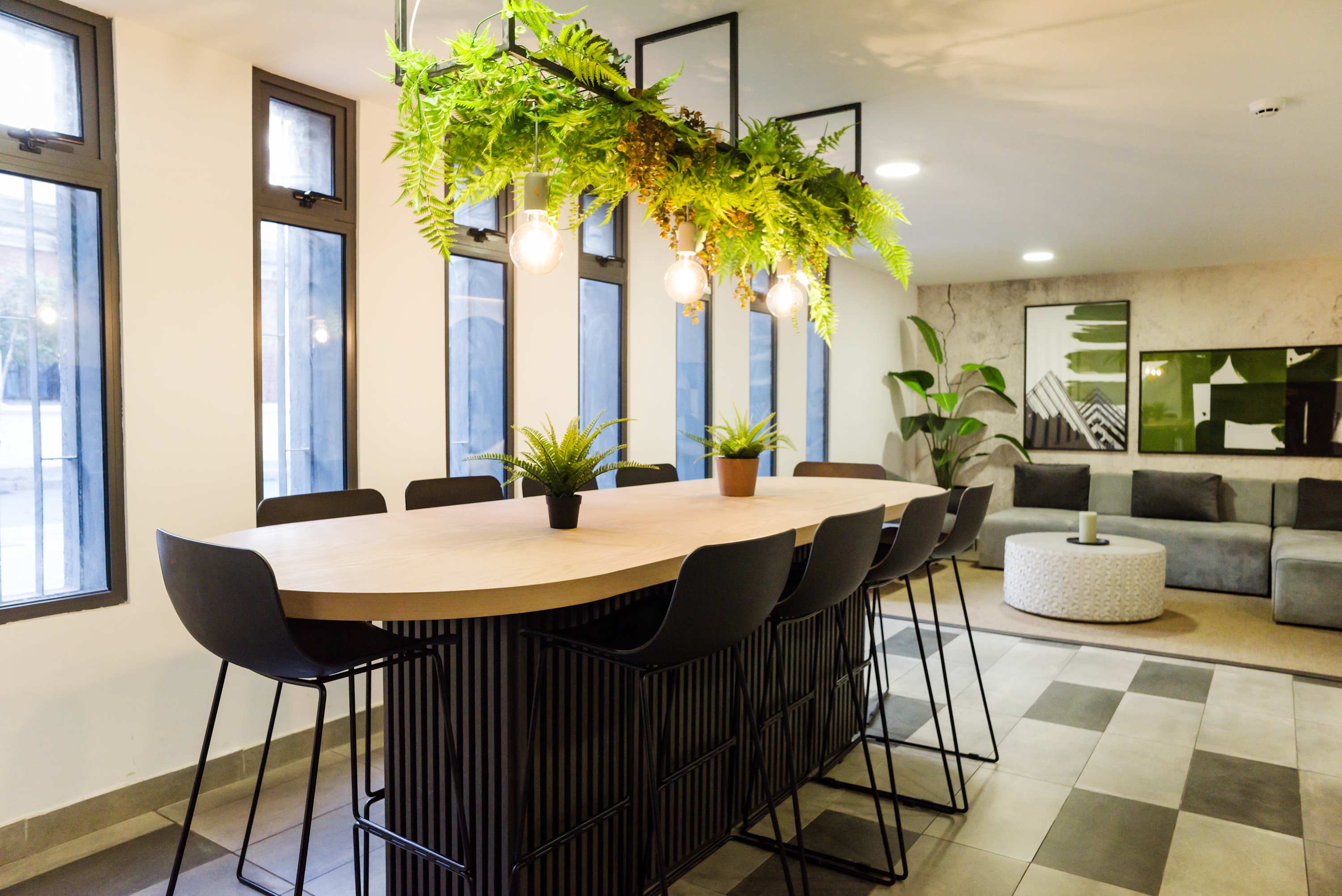 Relax in this stylish lounge with modern decor and ample seating, perfect for socializing or unwinding. (Common Area)