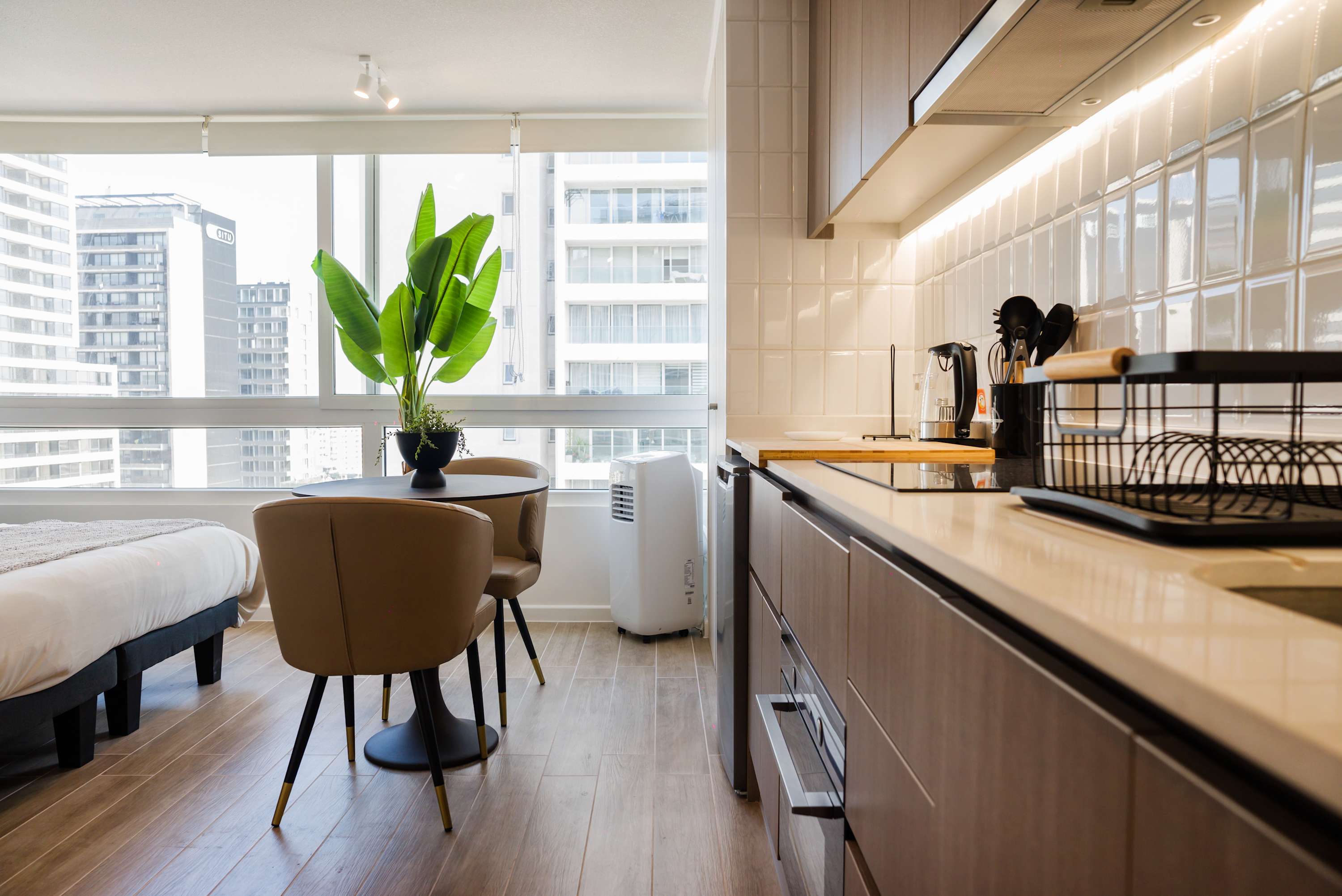 Bright and modern kitchen with city views, perfect for enjoying a cozy meal.