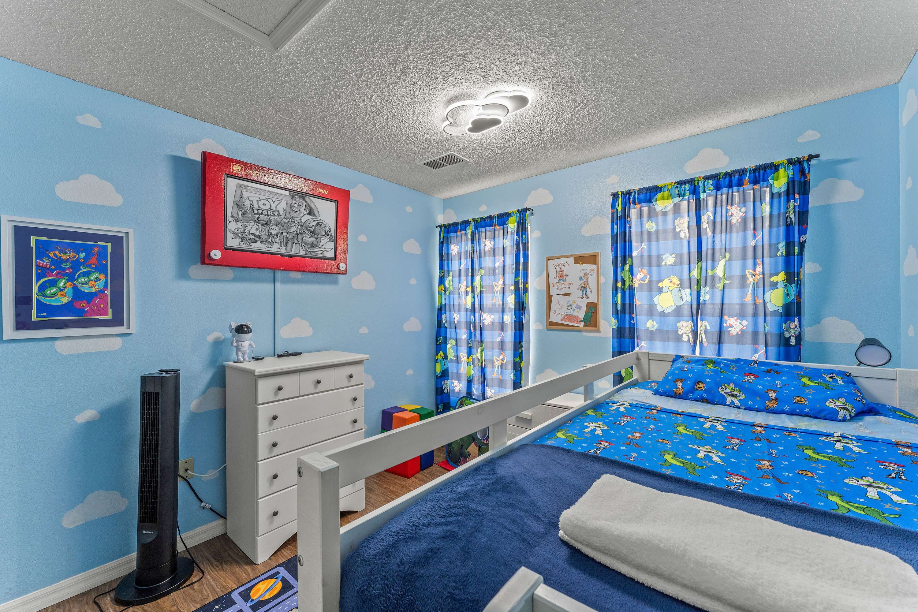 Bedroom 2: Toy Story themed with twin/twin bunk bed, and Smart TV
