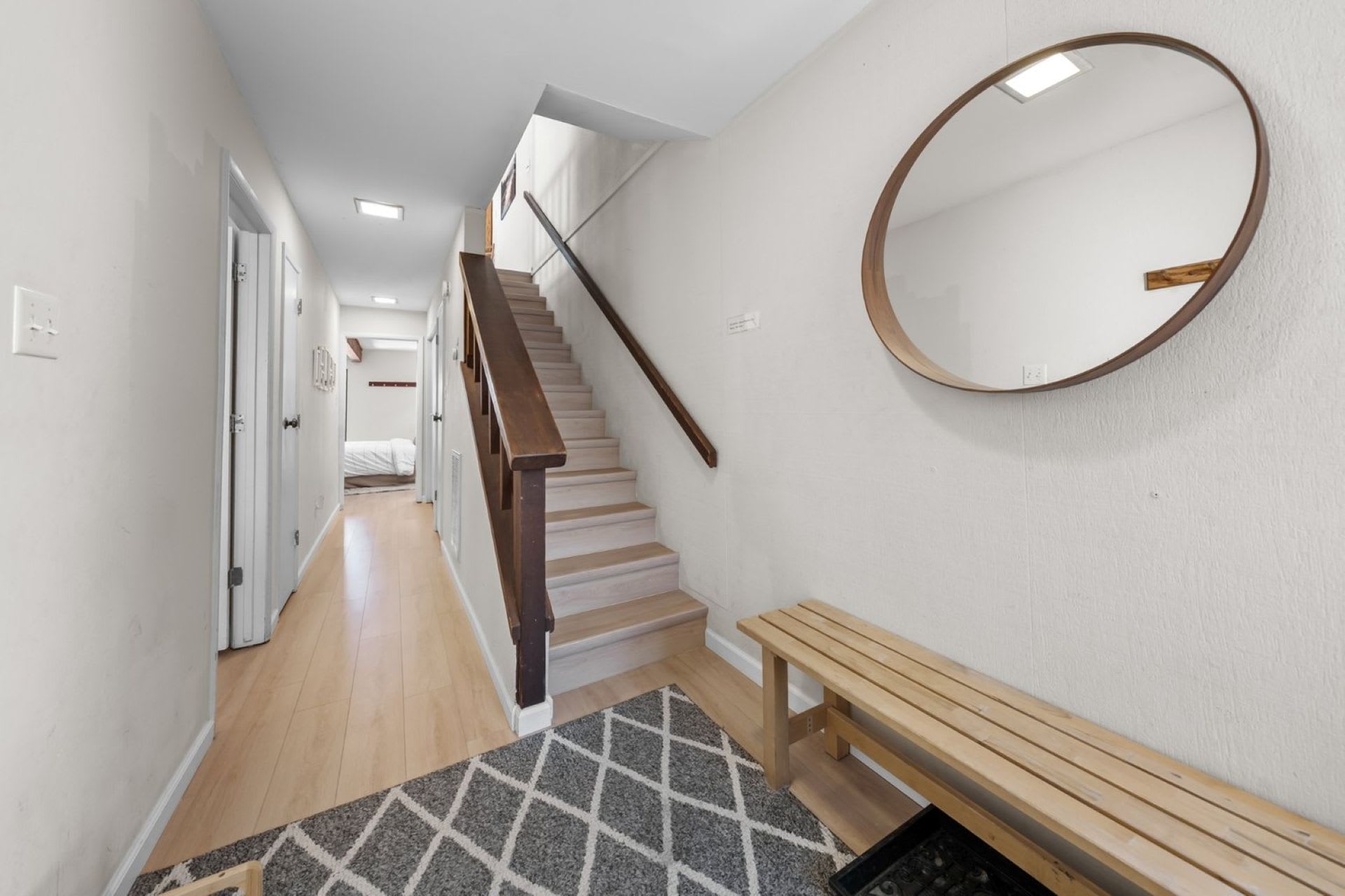 Ground floor staircase leading to living room and kitchen area 