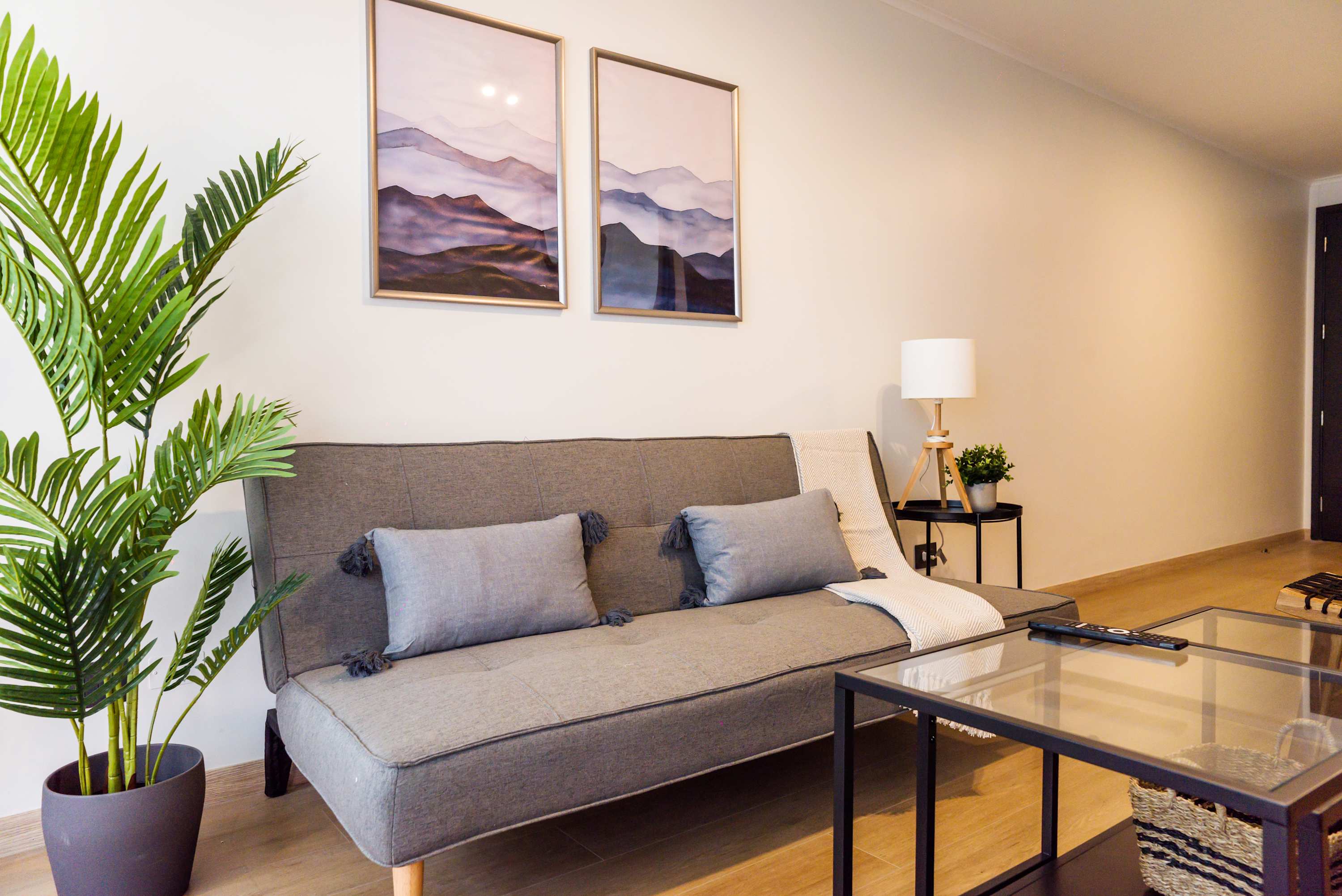 Relax in this stylish living area with chic decor and cozy seating, perfect for unwinding after a day of exploring.