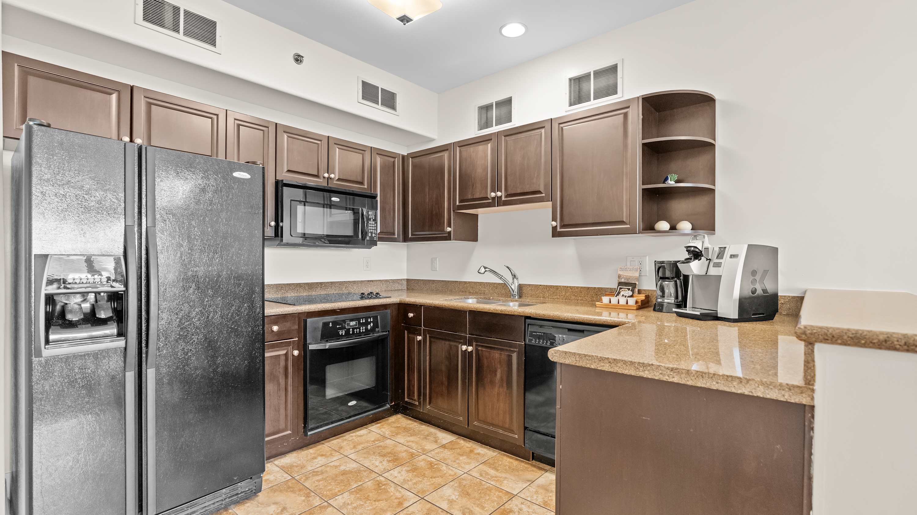 The inviting open kitchen offers ample space & every home comfort​