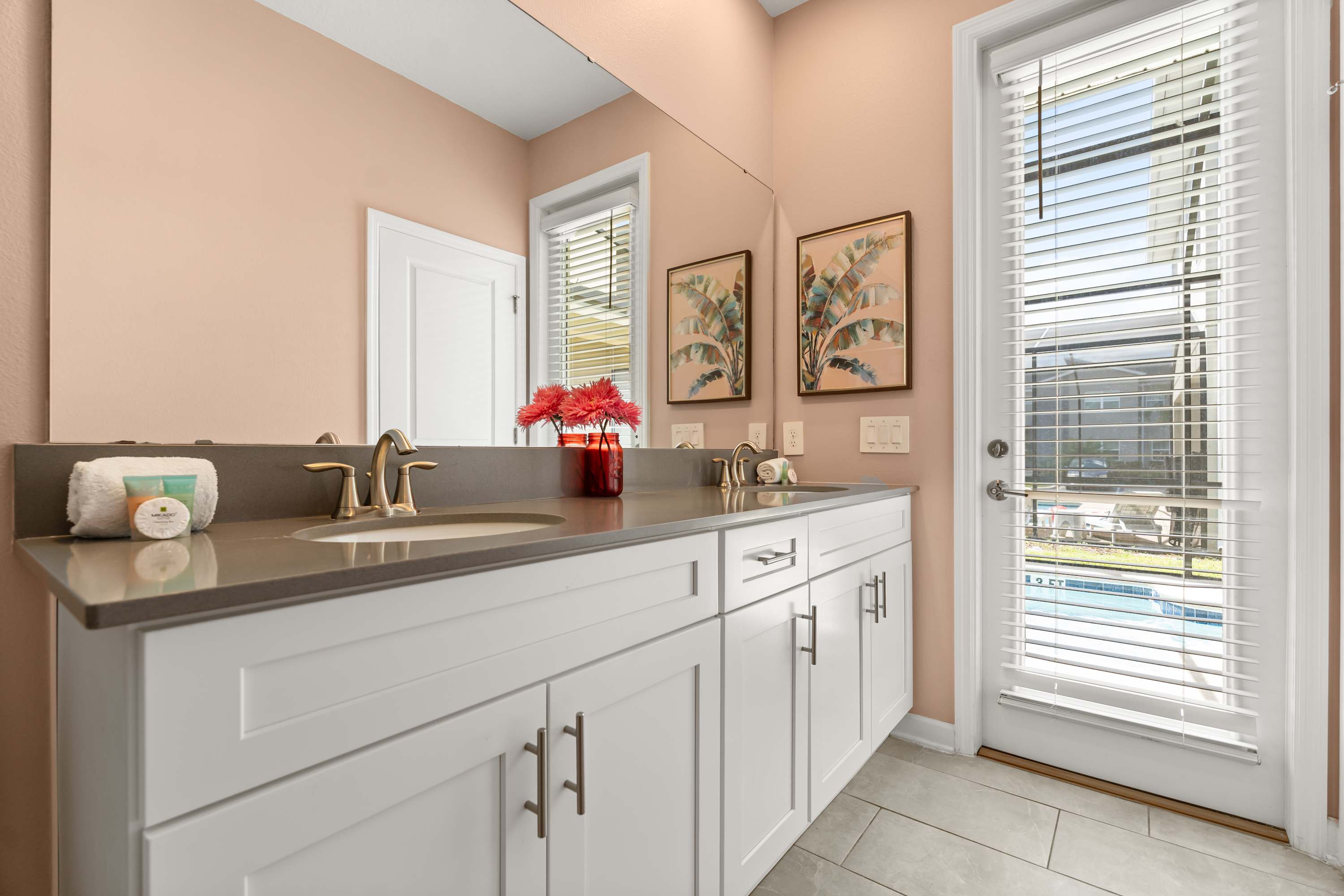 Spacious ensuite bathroom with dual sinks and walk-in shower.