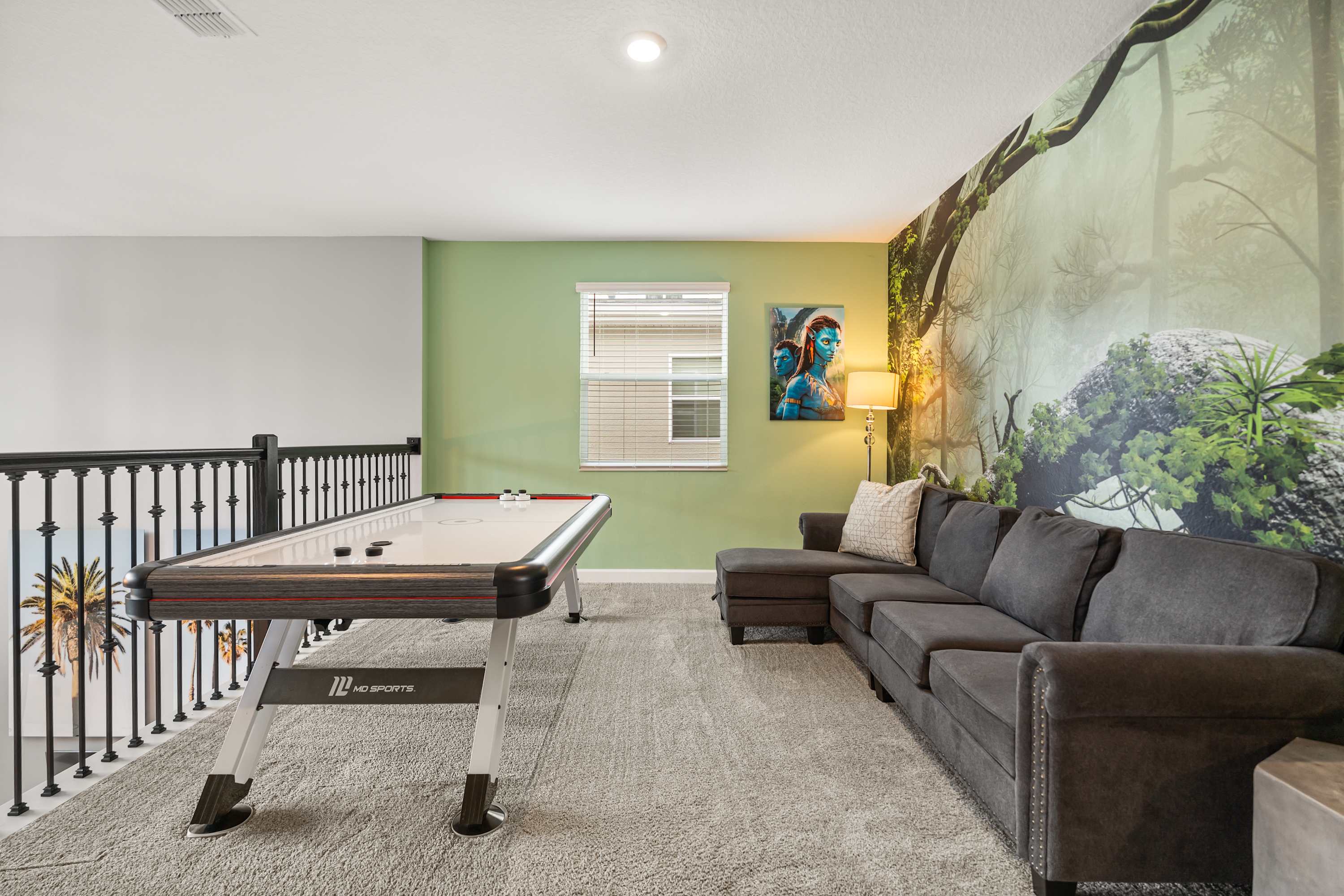 Dedicated game room with foosball and air hockey for endless family fun.