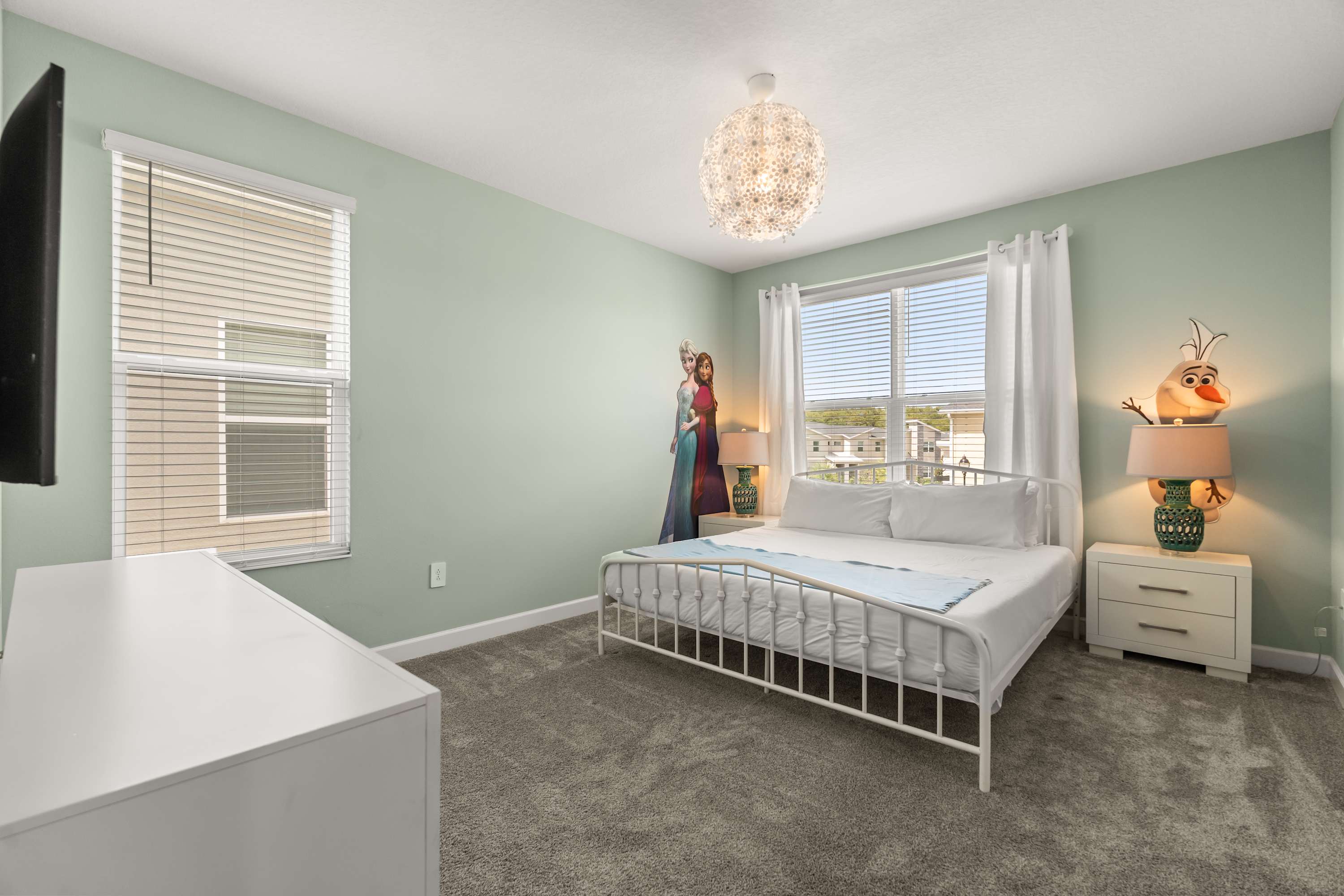 Enjoy hotel-style luxury in this peaceful king bedroom, ideal for restful nights.