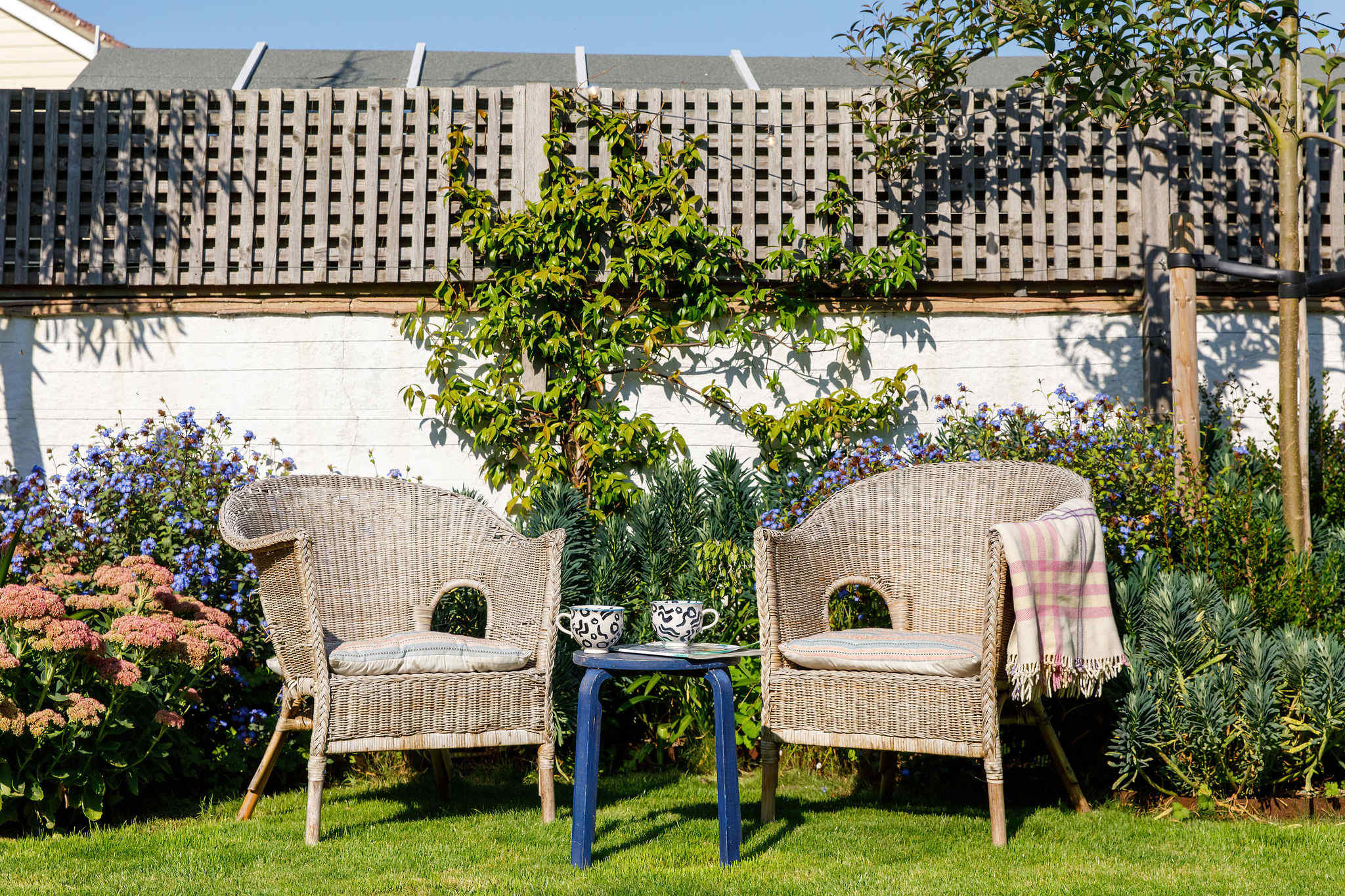 Enjoy a morning coffee in the coastal garden in the sunshine.