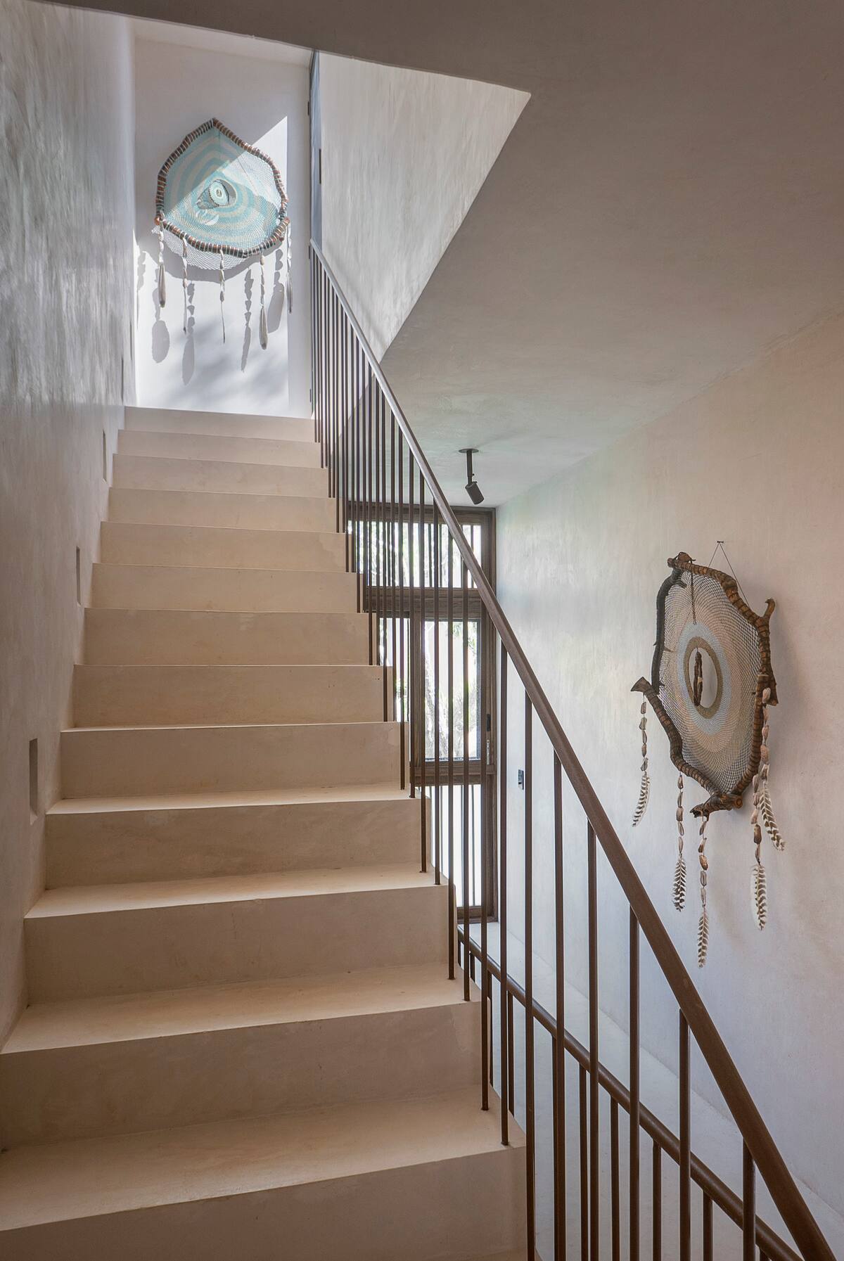 Second floor hosting bedrooms 2 and 3, with stairs leading to the rooftop oasis