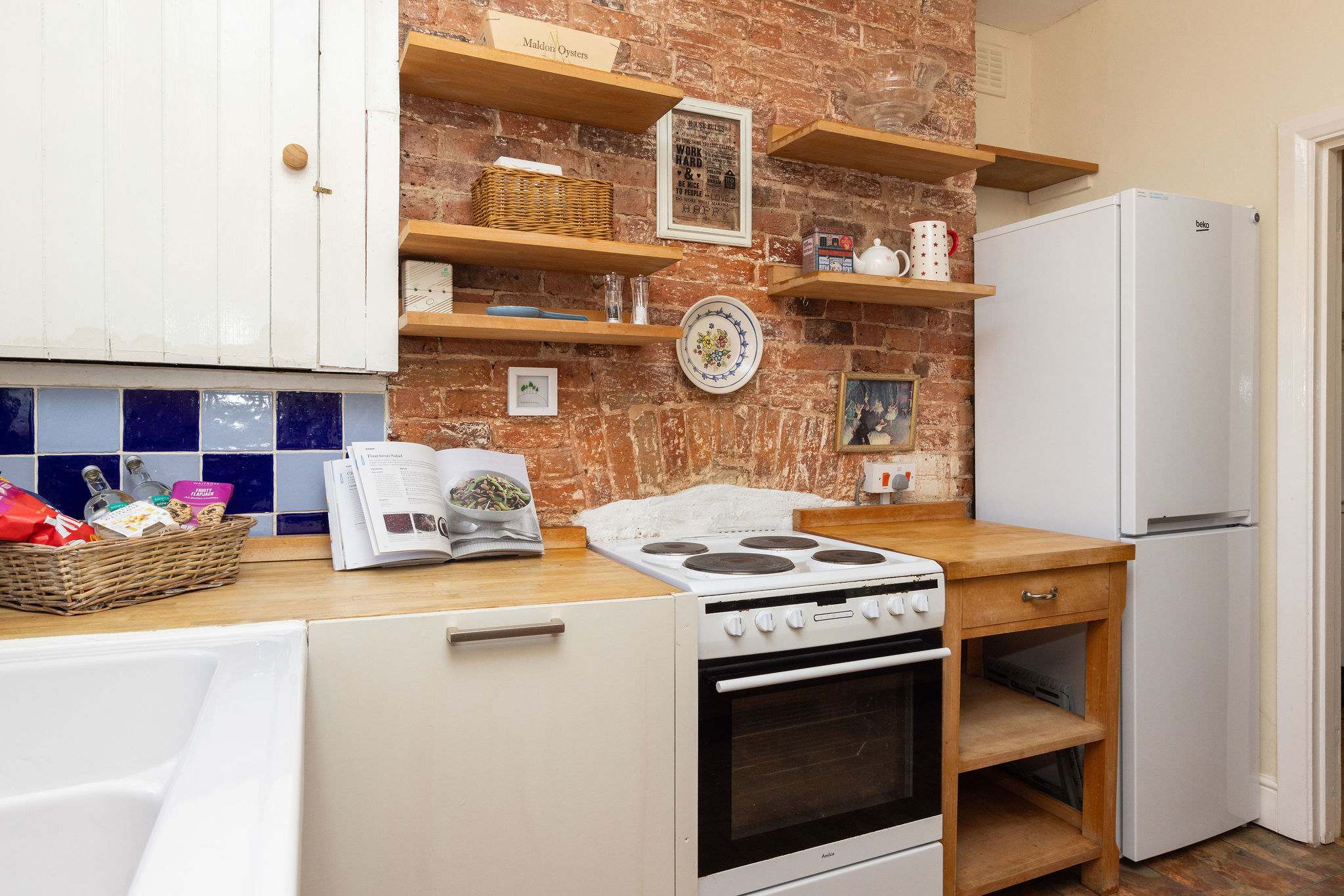 Fully-equipped kitchen with an oven and fridge, ready for your home-cooked meals.