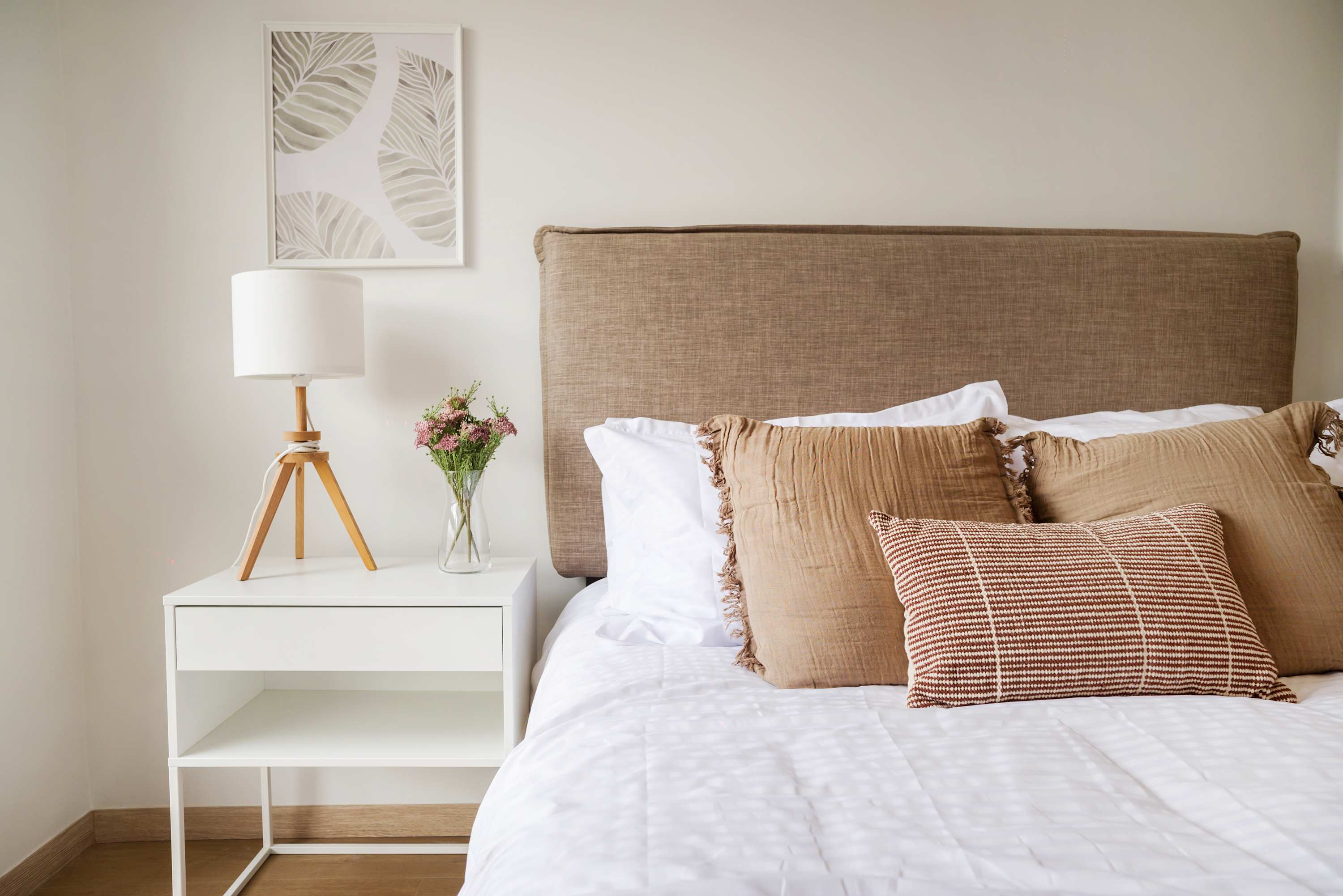 Unwind in this serene bedroom with stylish decor and a cozy atmosphere, perfect for a peaceful retreat.
