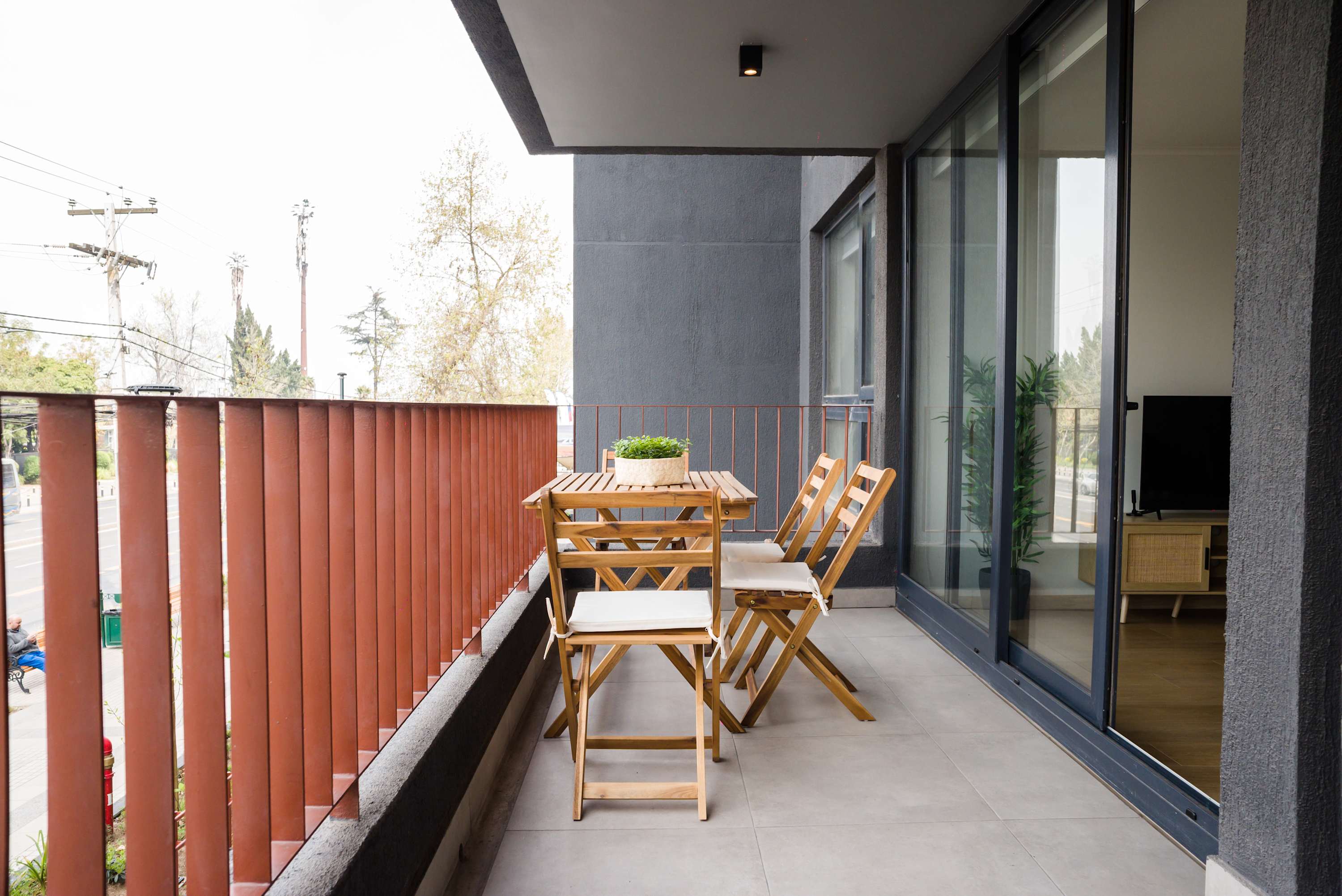 Enjoy your morning coffee on this charming balcony with street views, perfect for relaxation.