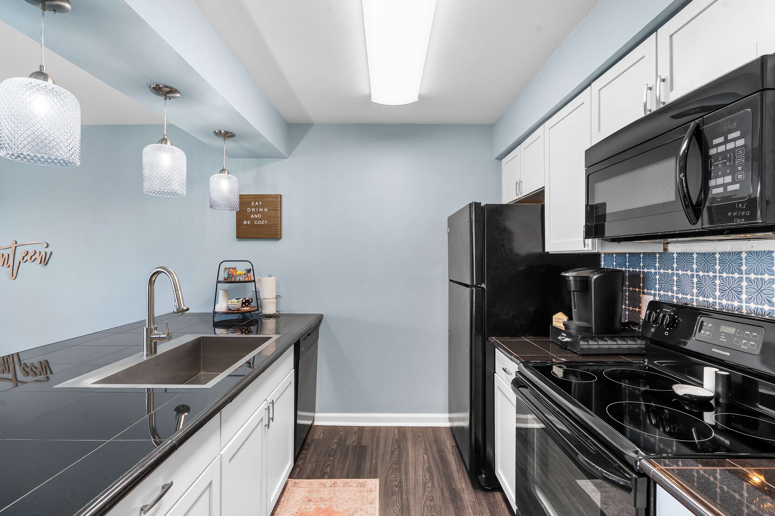 The open kitchen offers ample space & all the comforts of home​