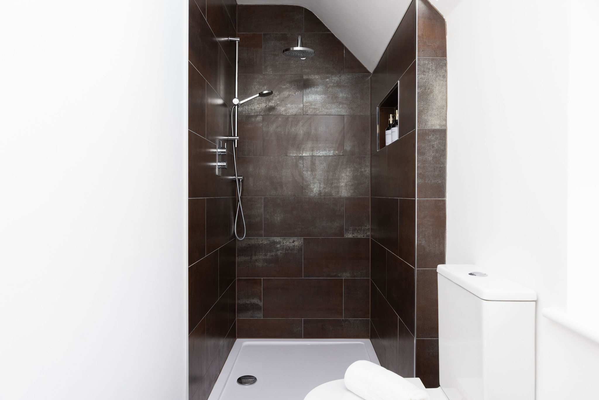 The family bathroom's second shower, perfect for busy group mornings.