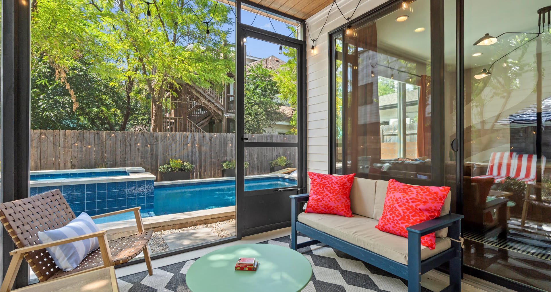 Contemporary patio with wide glass windows and stunning furnishings