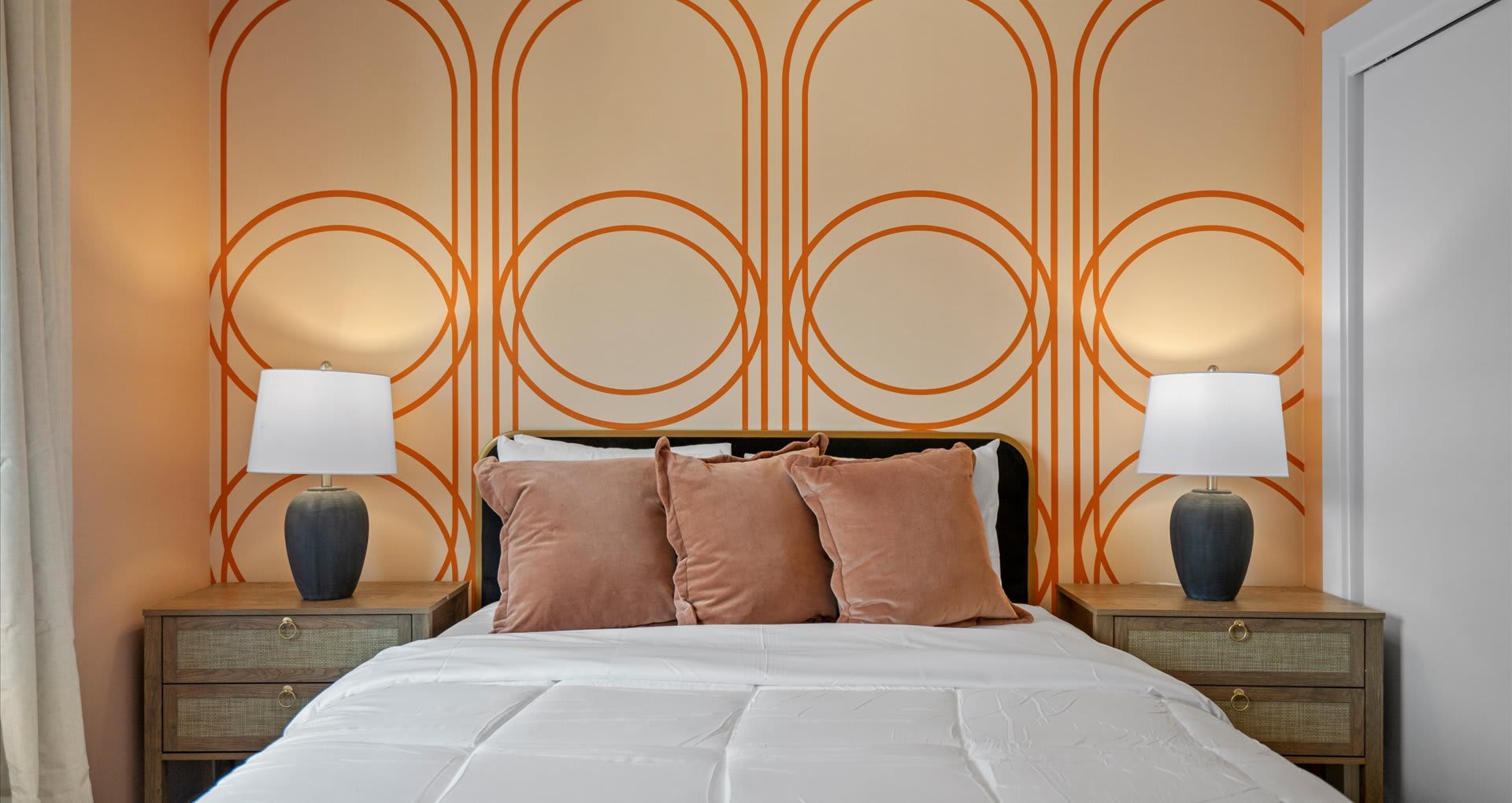 Elegant queen bedroom with large glass windows 