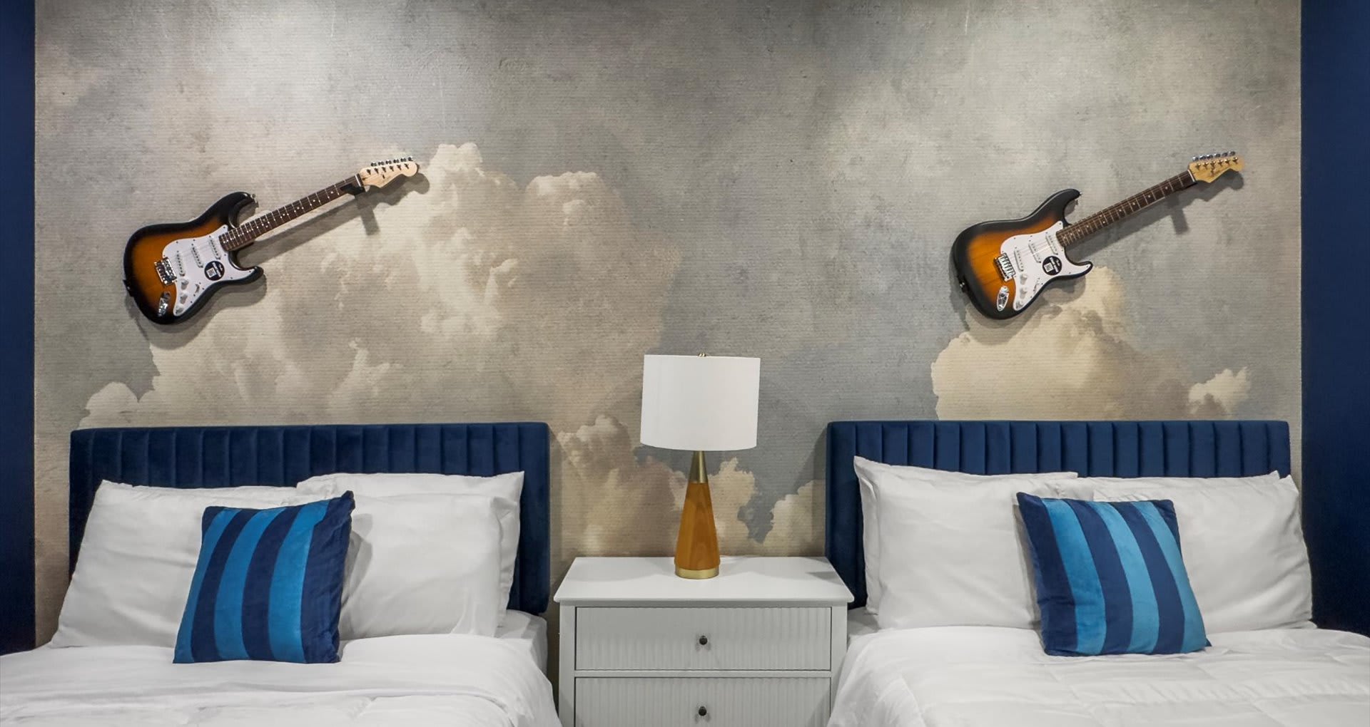 Spacious twin bedroom with two cozy double beds, perfect for friends or family traveling together.