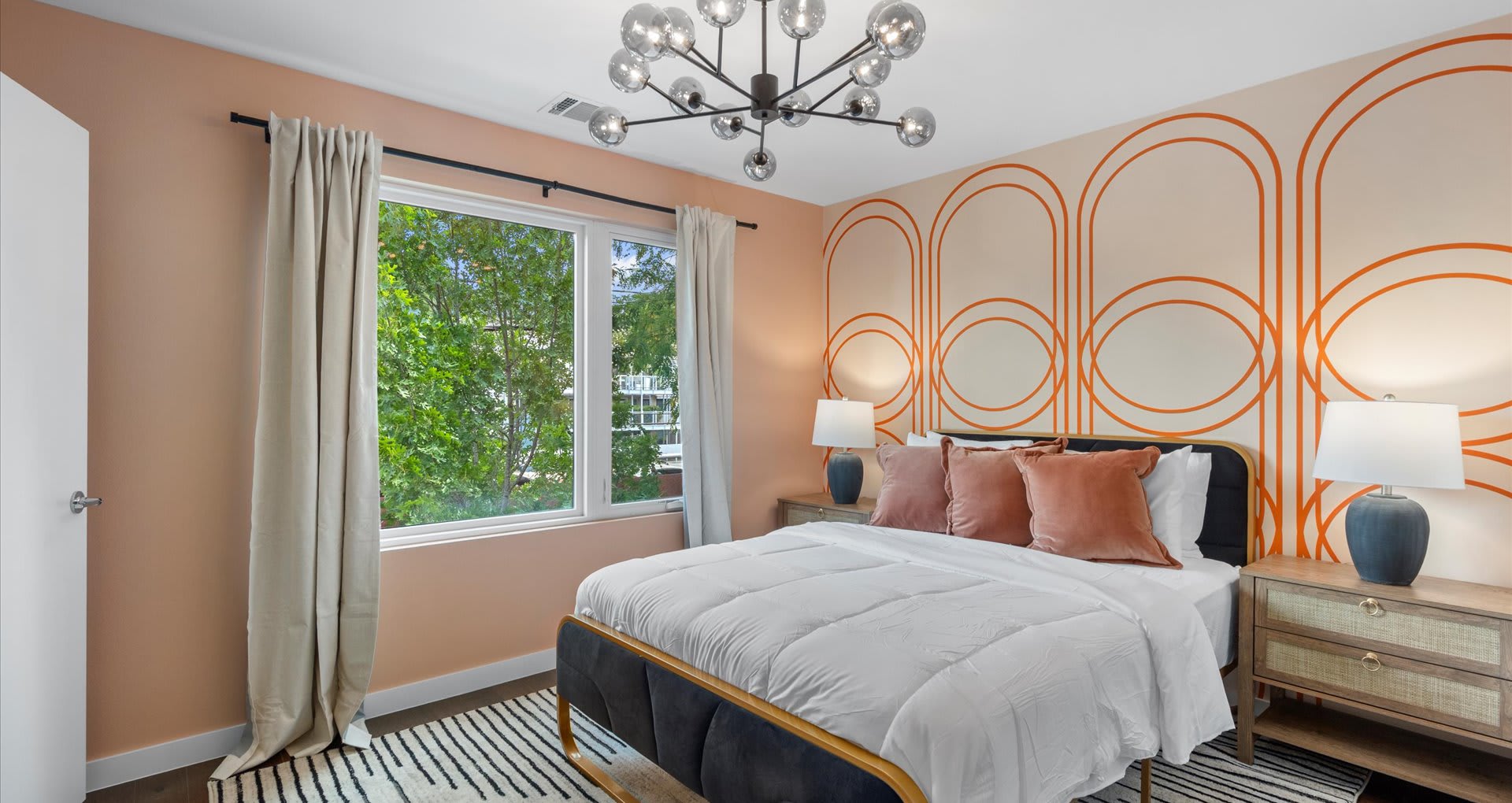 Elegant queen bedroom with large glass windows 