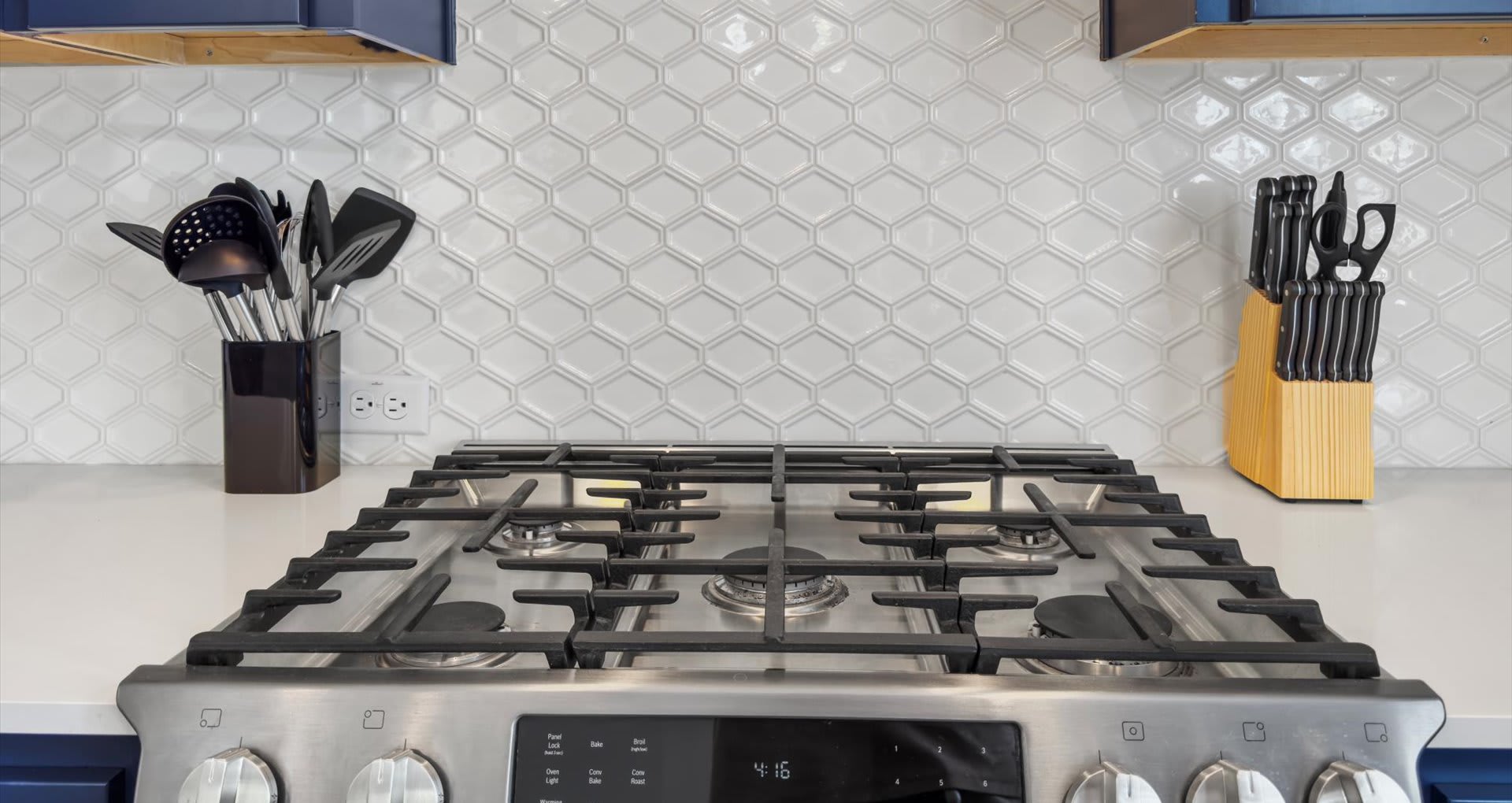  Modern gas stove with kitchen cooking essentials