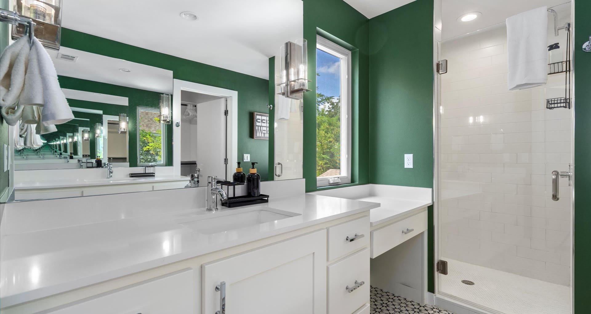 Gorgeous en-suite bathroom with earth tones featuring a modern standing shower