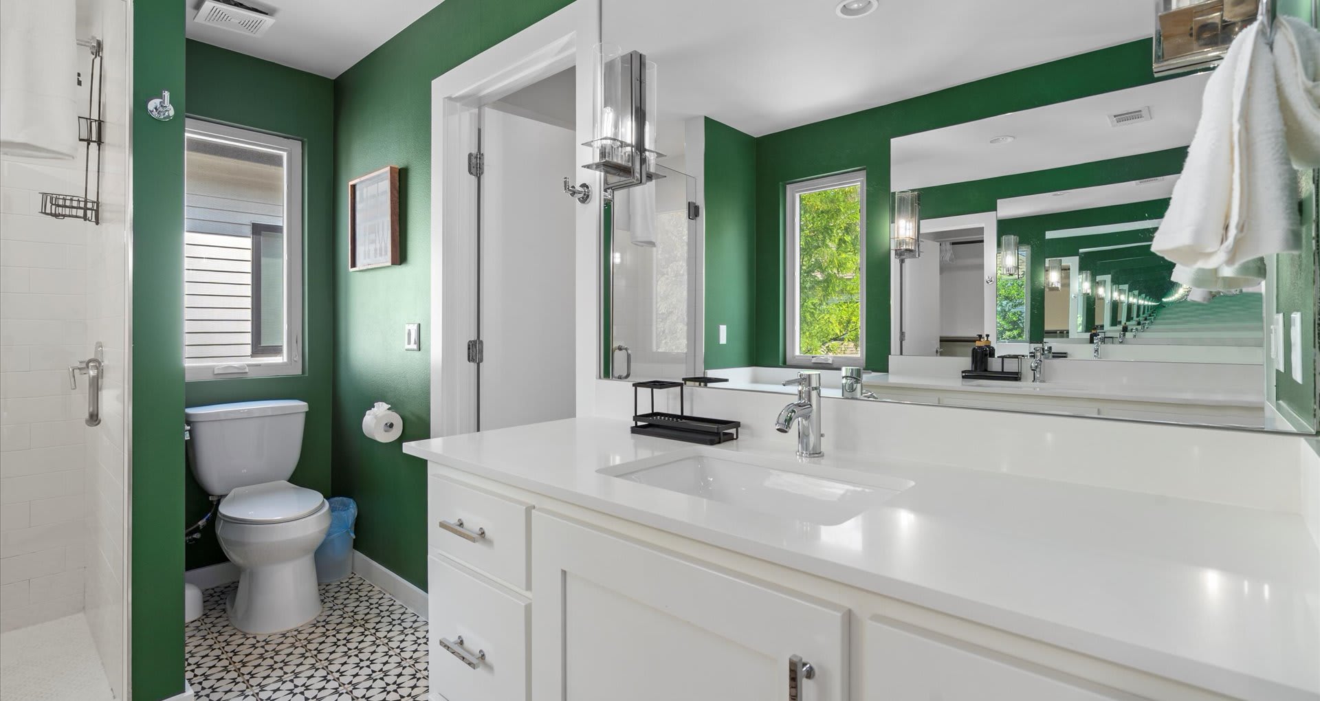 Gorgeous en-suite bathroom with earth tones featuring a modern standing shower