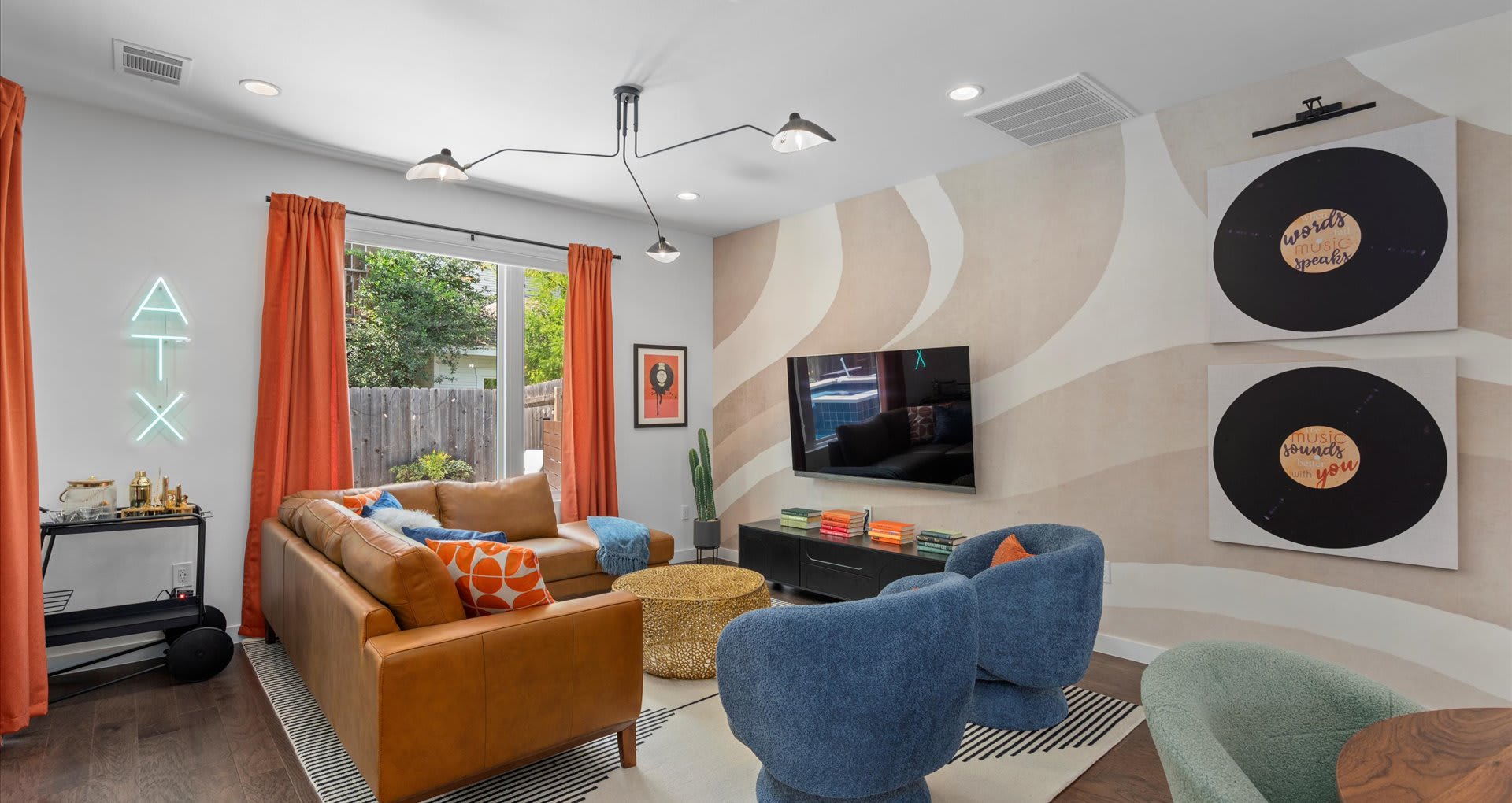 Bright living room with comfortable sofa and eclectic décor 