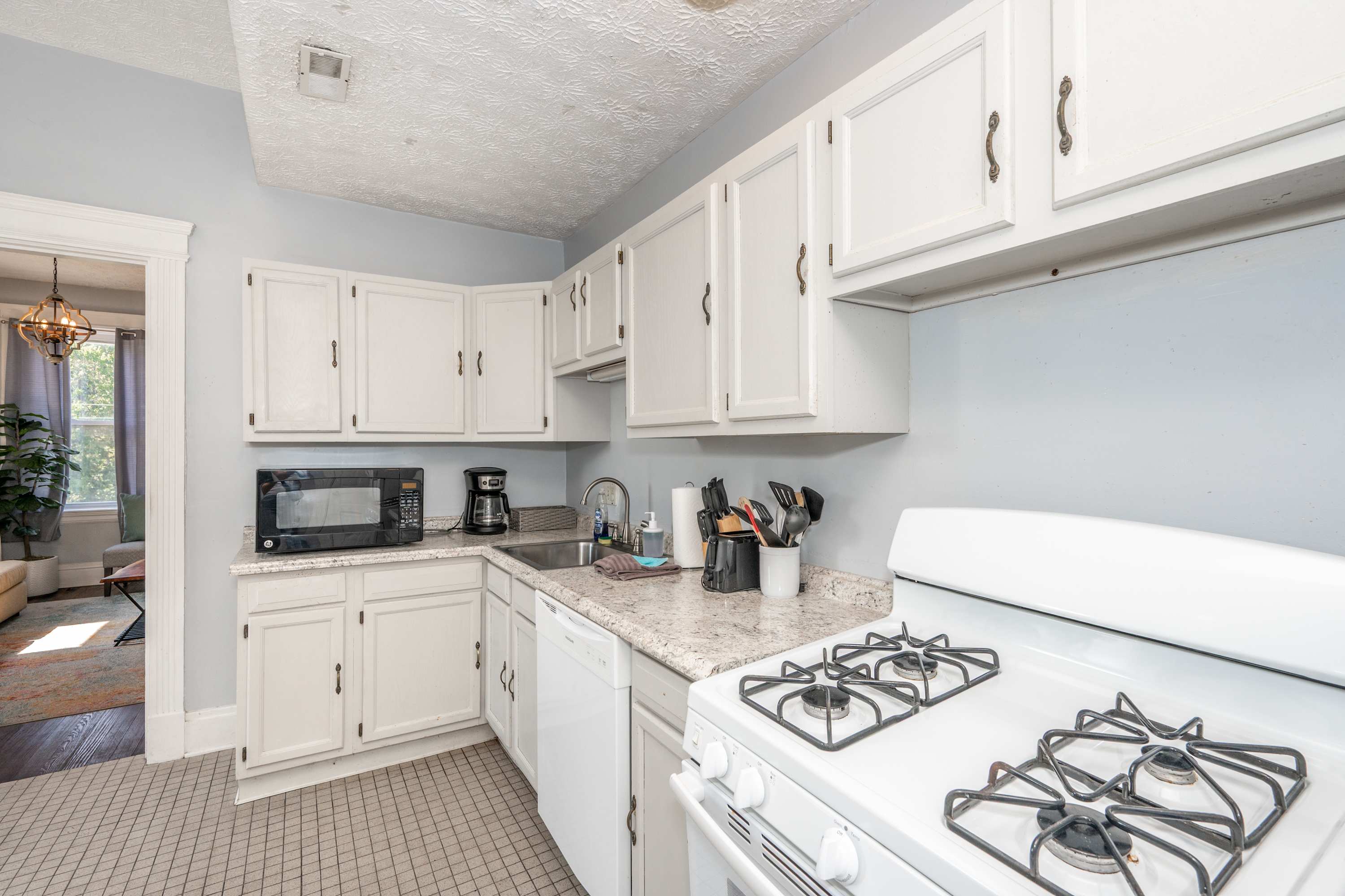 The breezy kitchen is well equipped for an unforgettable getaway​