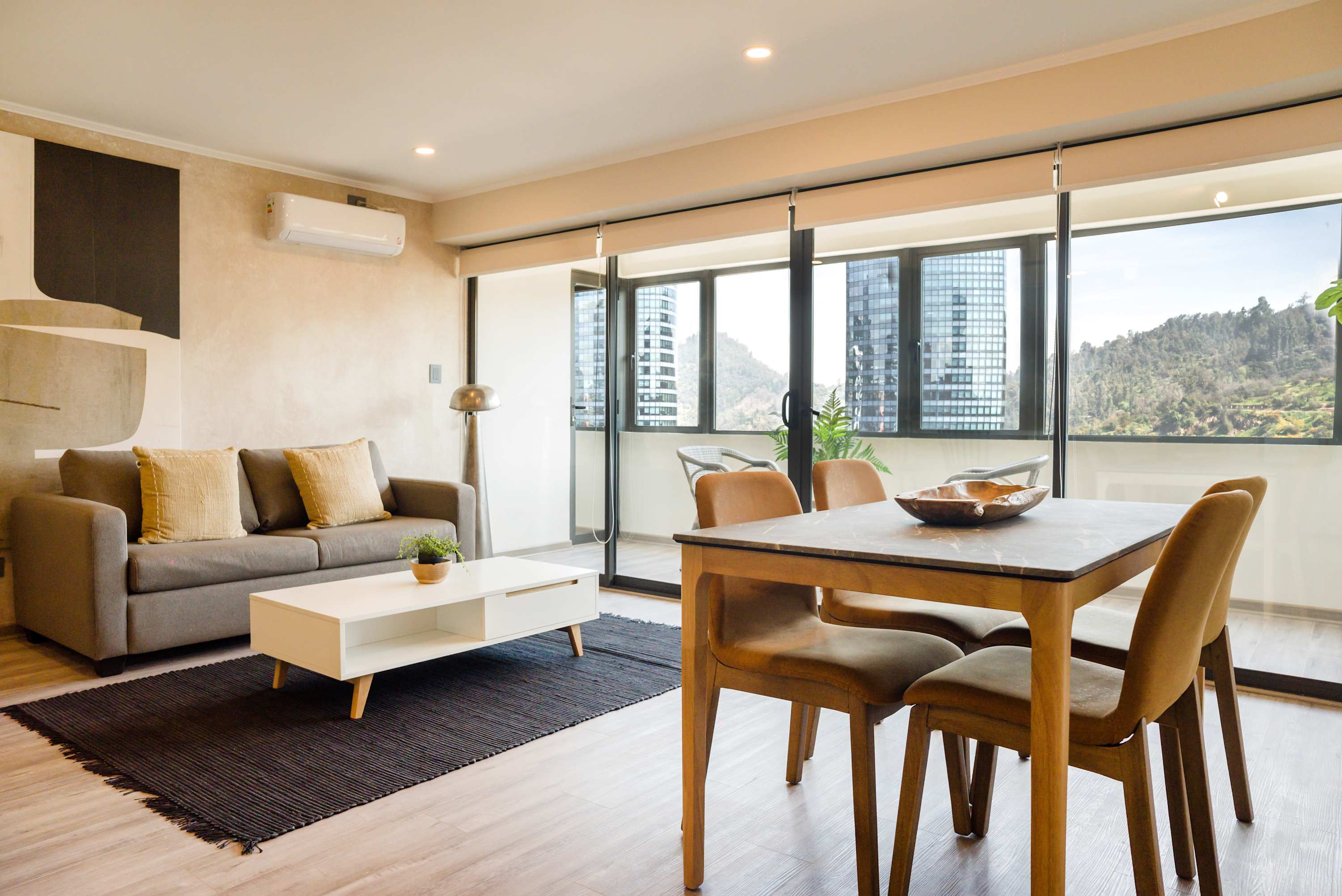 Enjoy a bright, modern living and dining space featuring large windows. It's the ideal spot to start your day or simply unwind while taking in the spectacular views.
