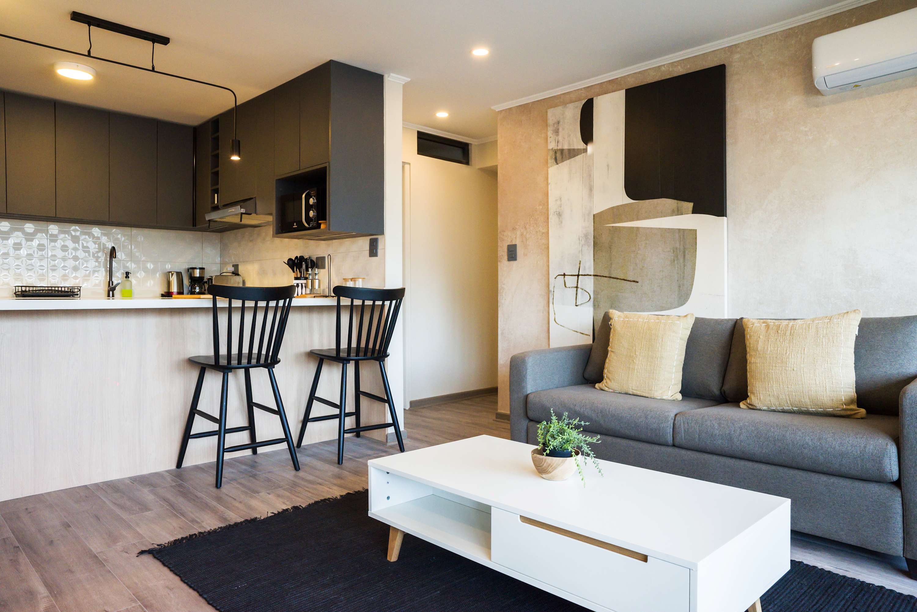 Enjoy the spacious, open floor plan that seamlessly connects the kitchen and the cozy living area. This space is perfectly designed for gathering, sharing moments, and socializing throughout your entire stay.