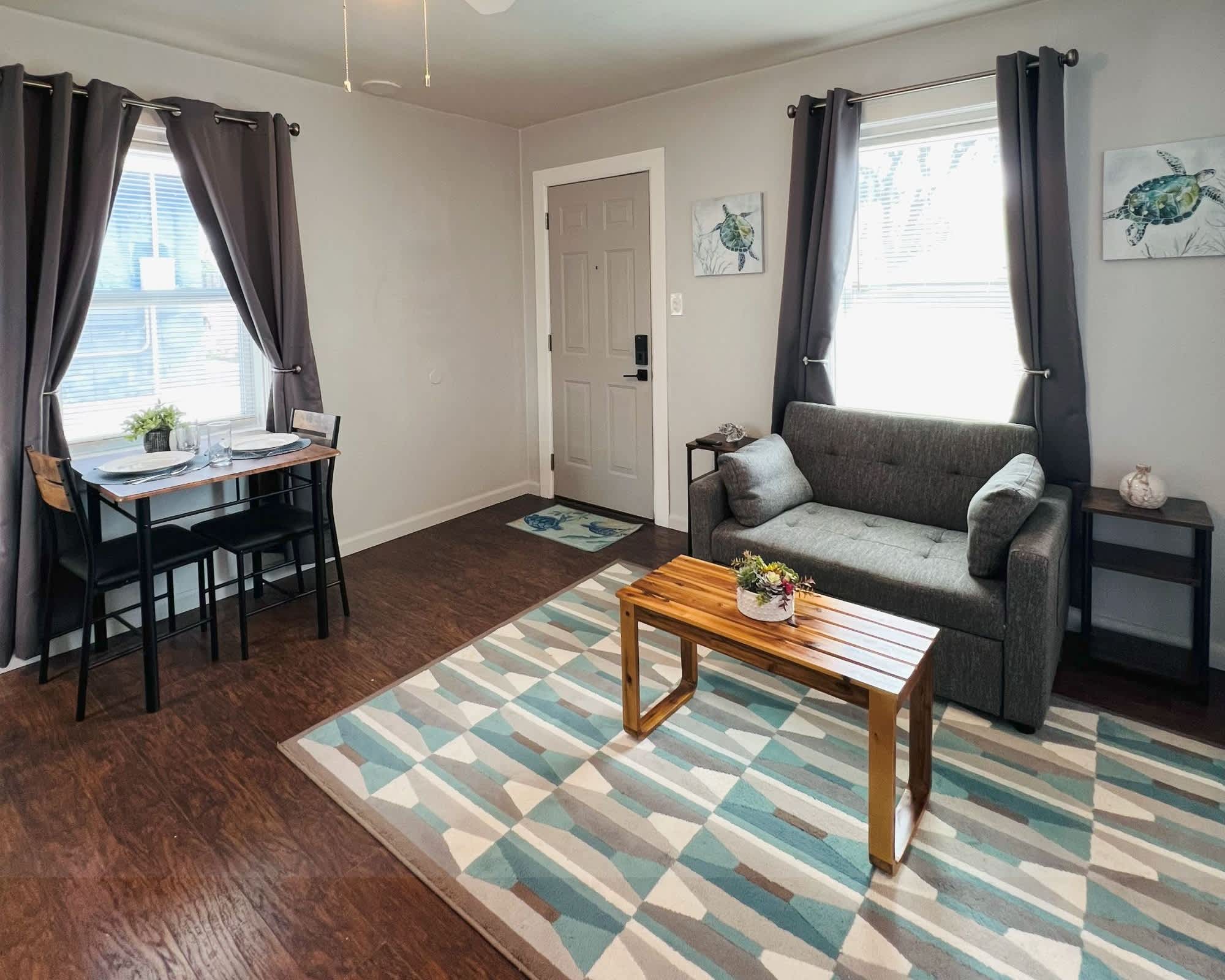 Cozy living space with small sofa sleeper and Smart TV