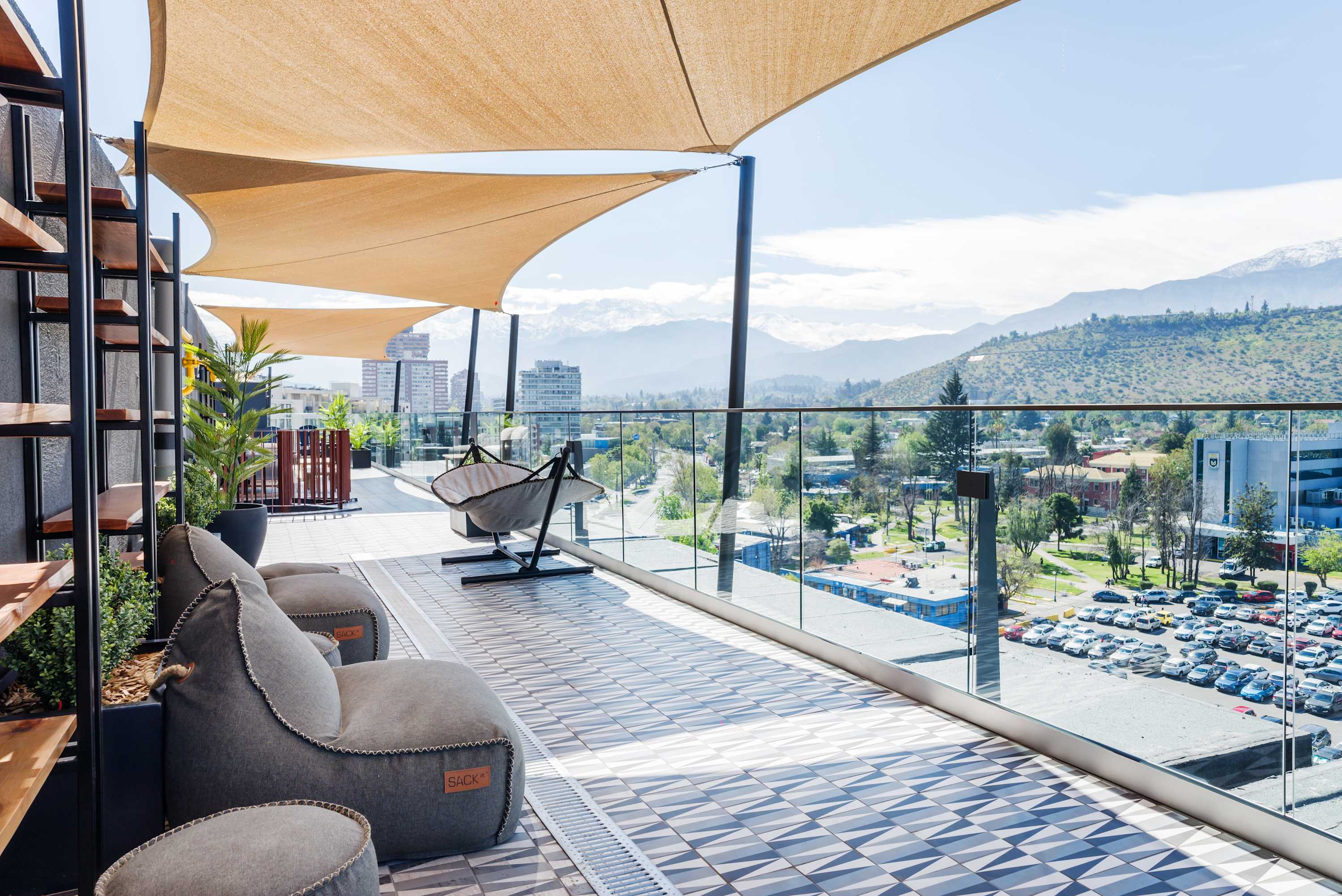 Relax on the stylish terrace with panoramic city and mountain views. Perfect for unwinding and enjoying the scenery. (Common Area)