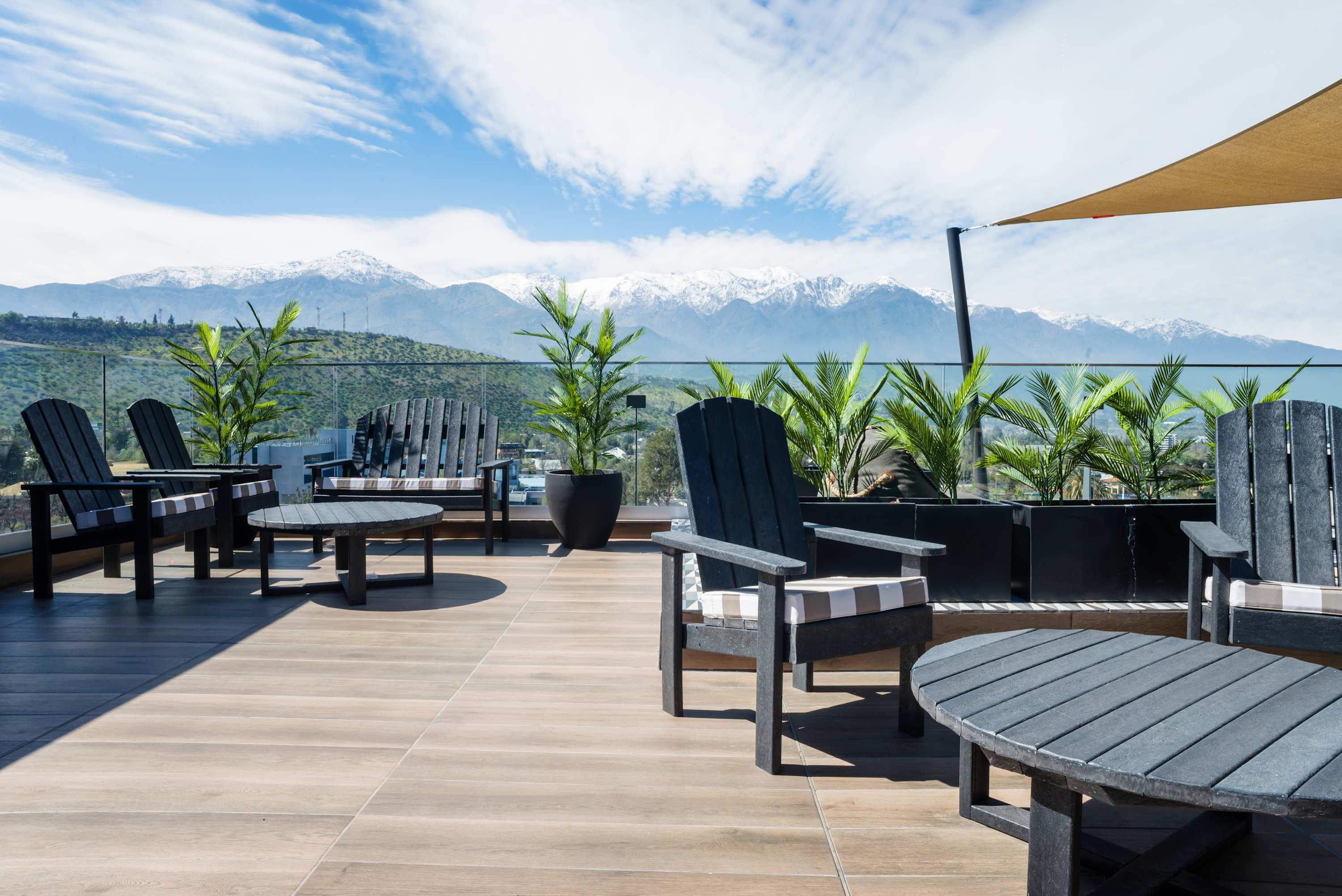 Relax on the terrace with breathtaking mountain views and comfortable seating. (Common Area)