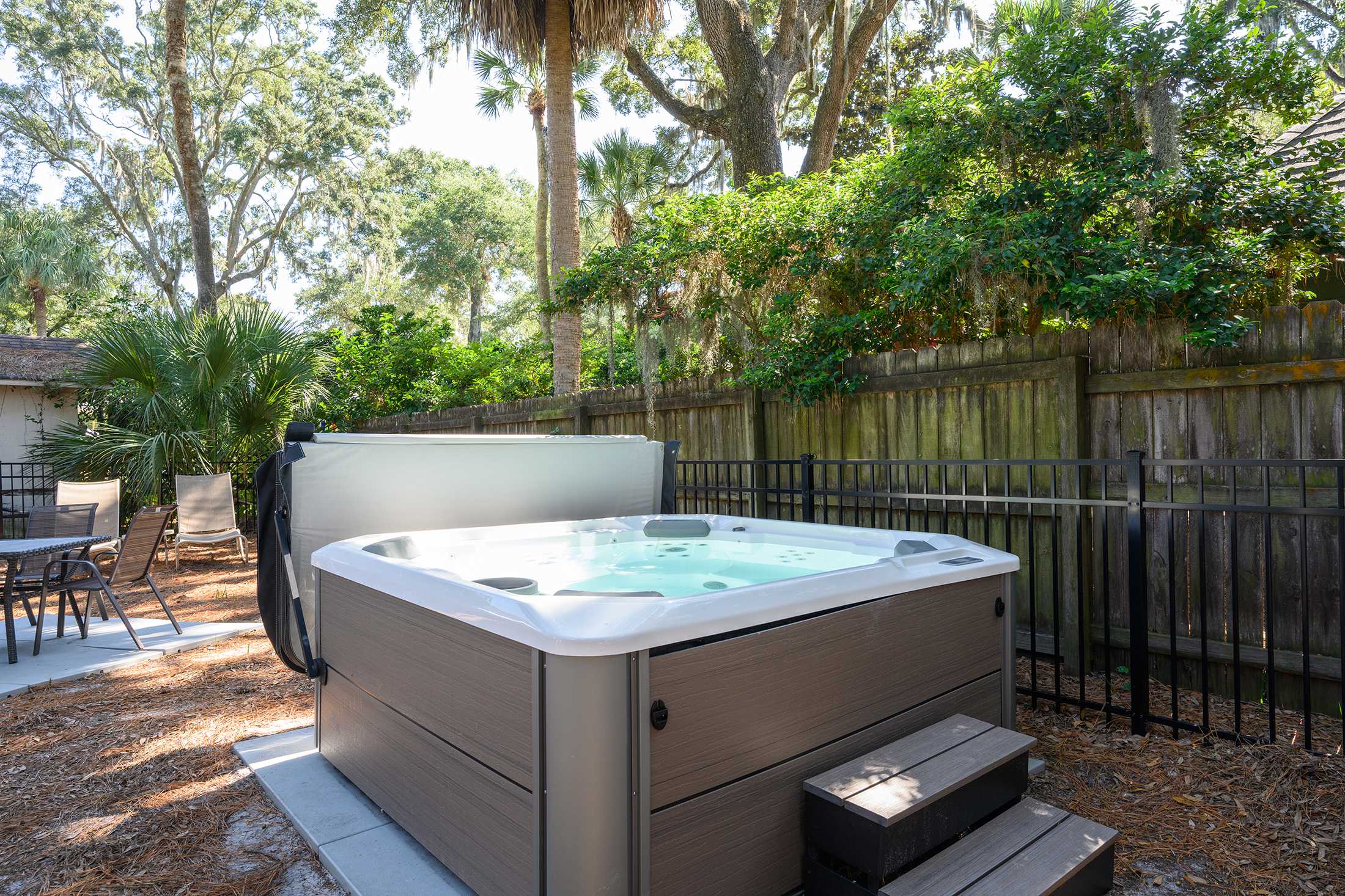 Unwind beneath shady oaks in your secluded spa.