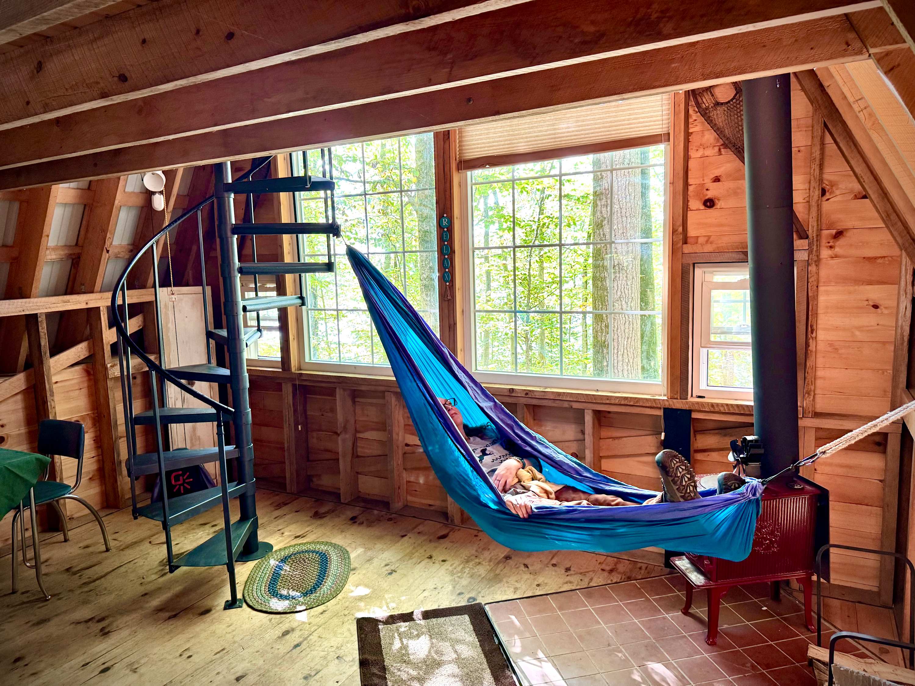 Chillax in front of our cozy wood stove in the indoor hammock.