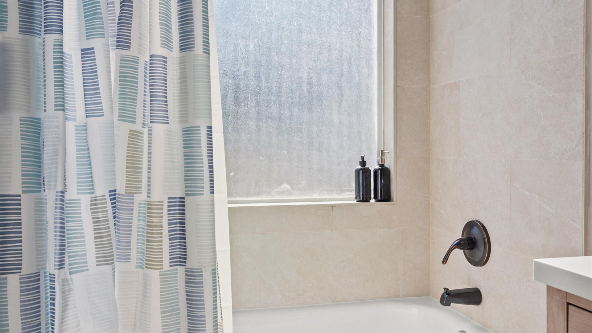 Freshly renovated en-suite bathroom integrated bath and shower 