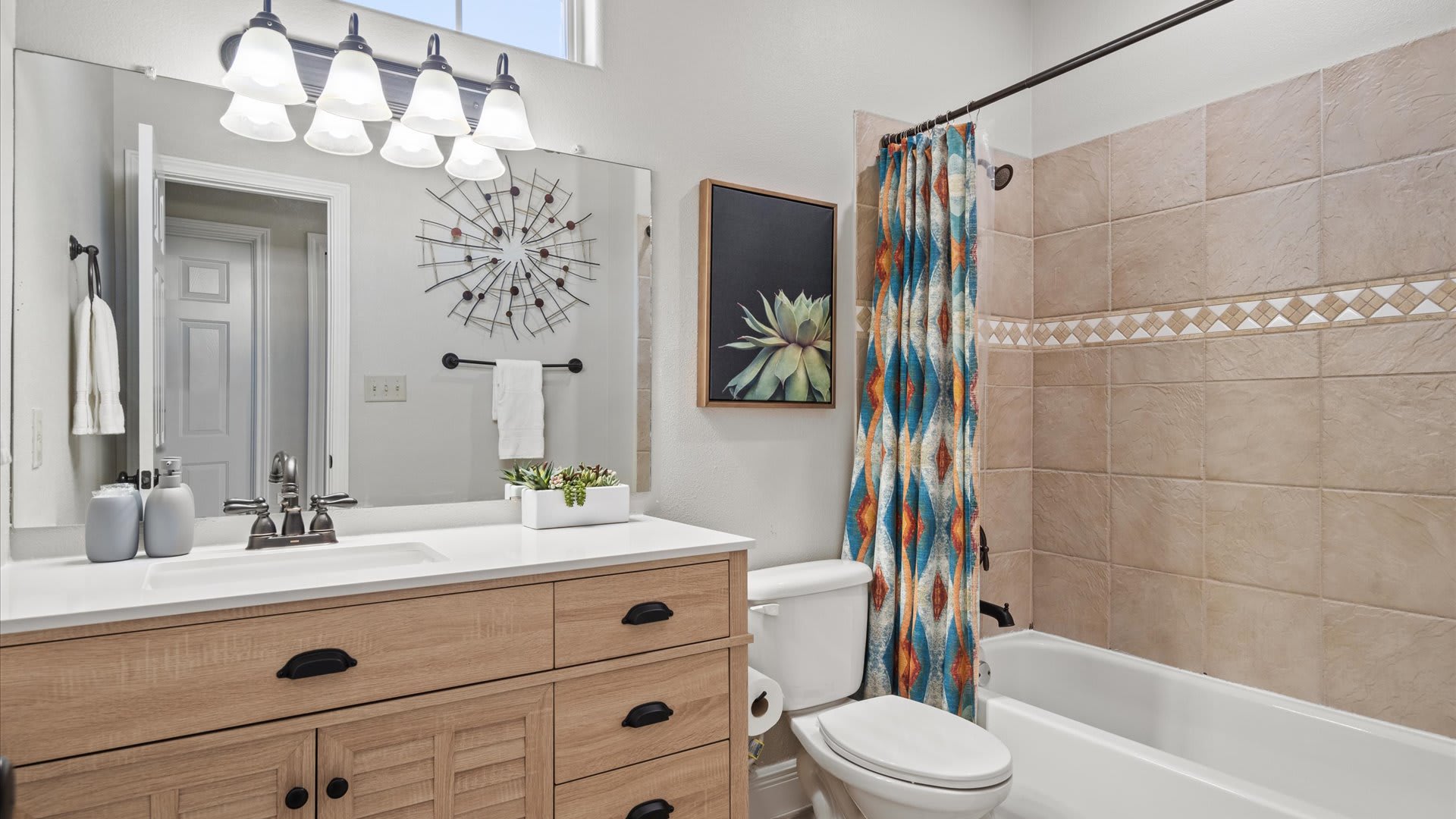 New renovated en-suite bathroom with integrated bath and shower 