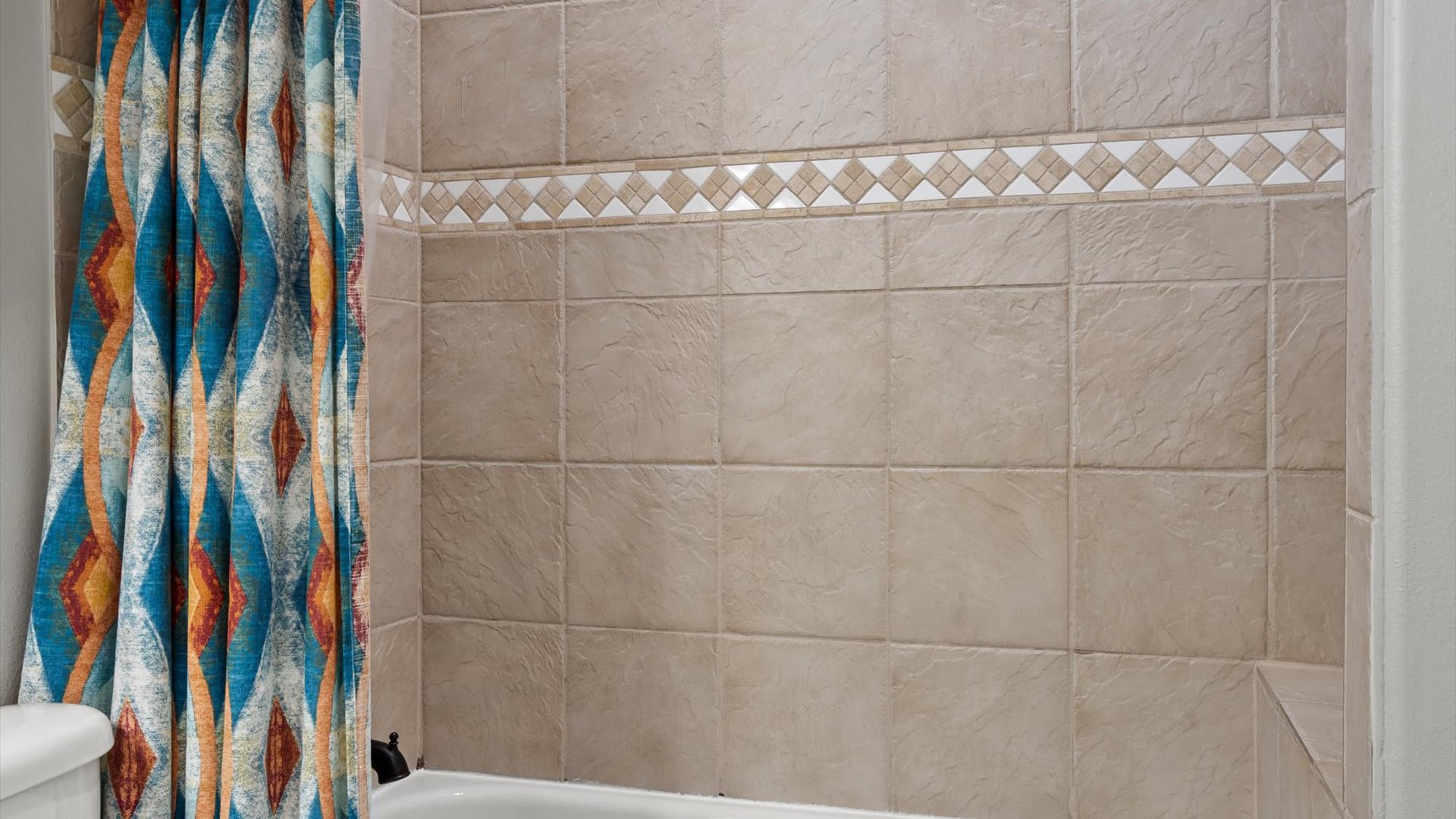 Newly renovated full bathroom with integrated bathtub and shower