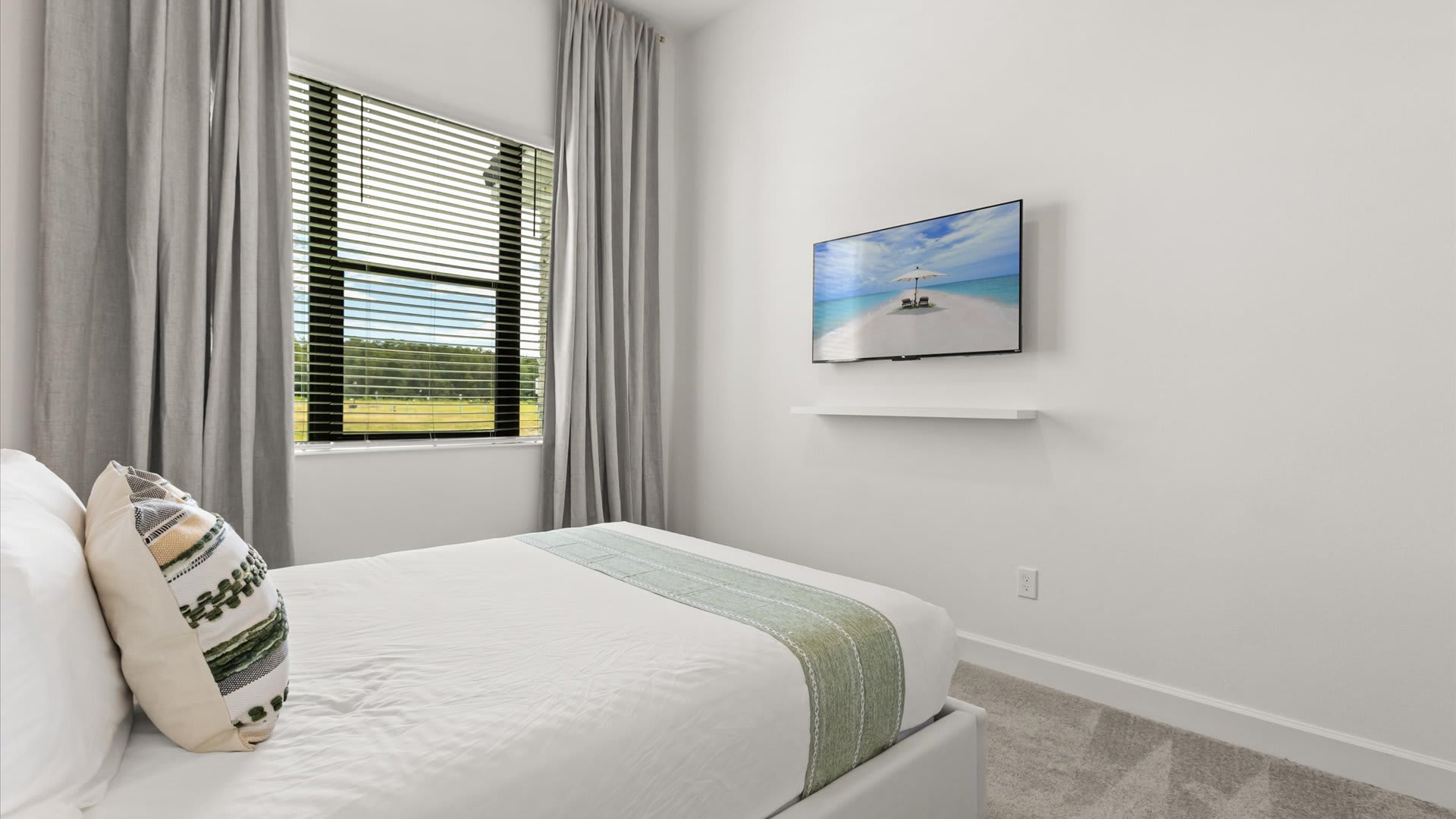 Queen bedroom with smart TV