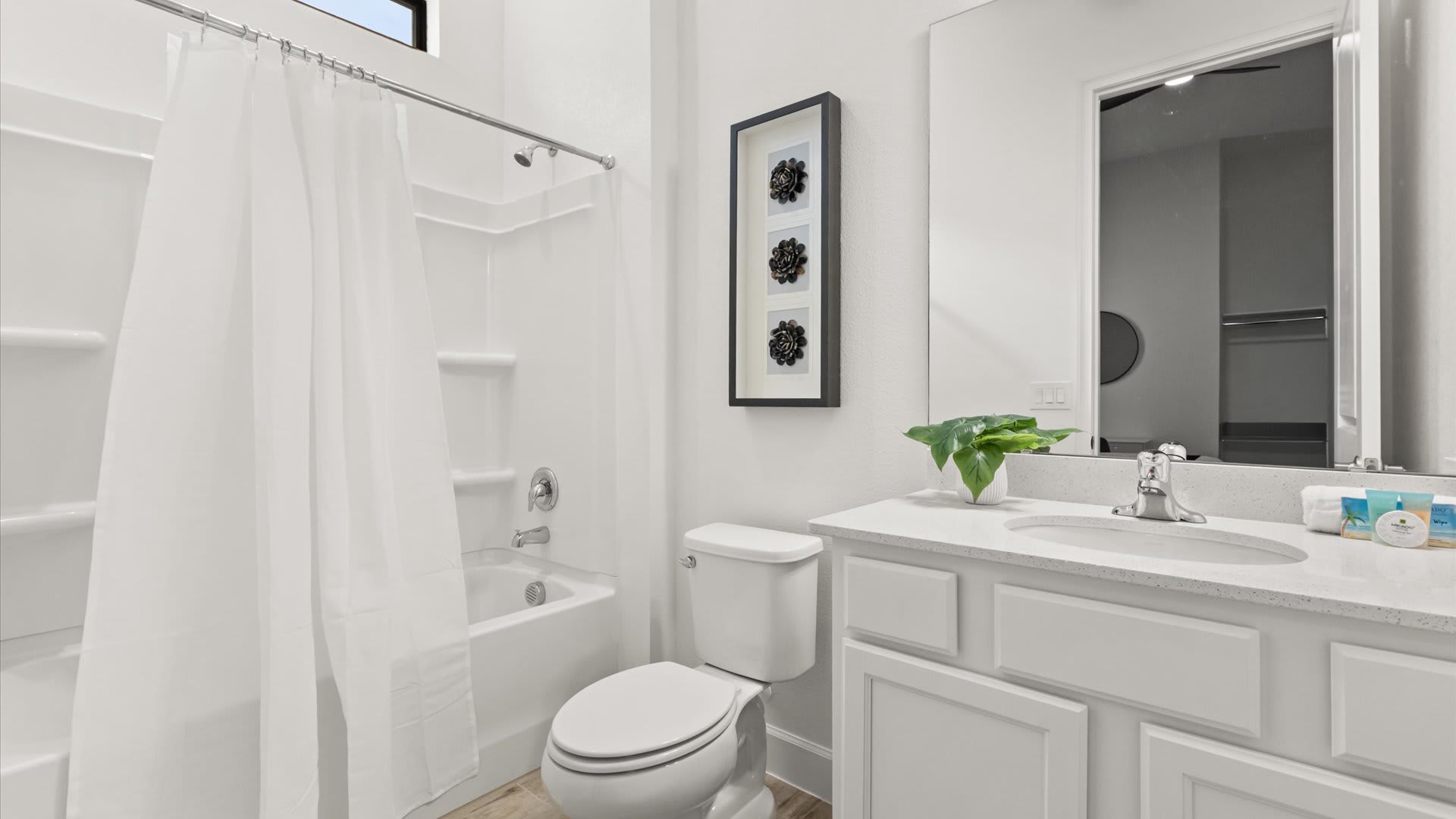 Full bathroom with combined bathtub and shower