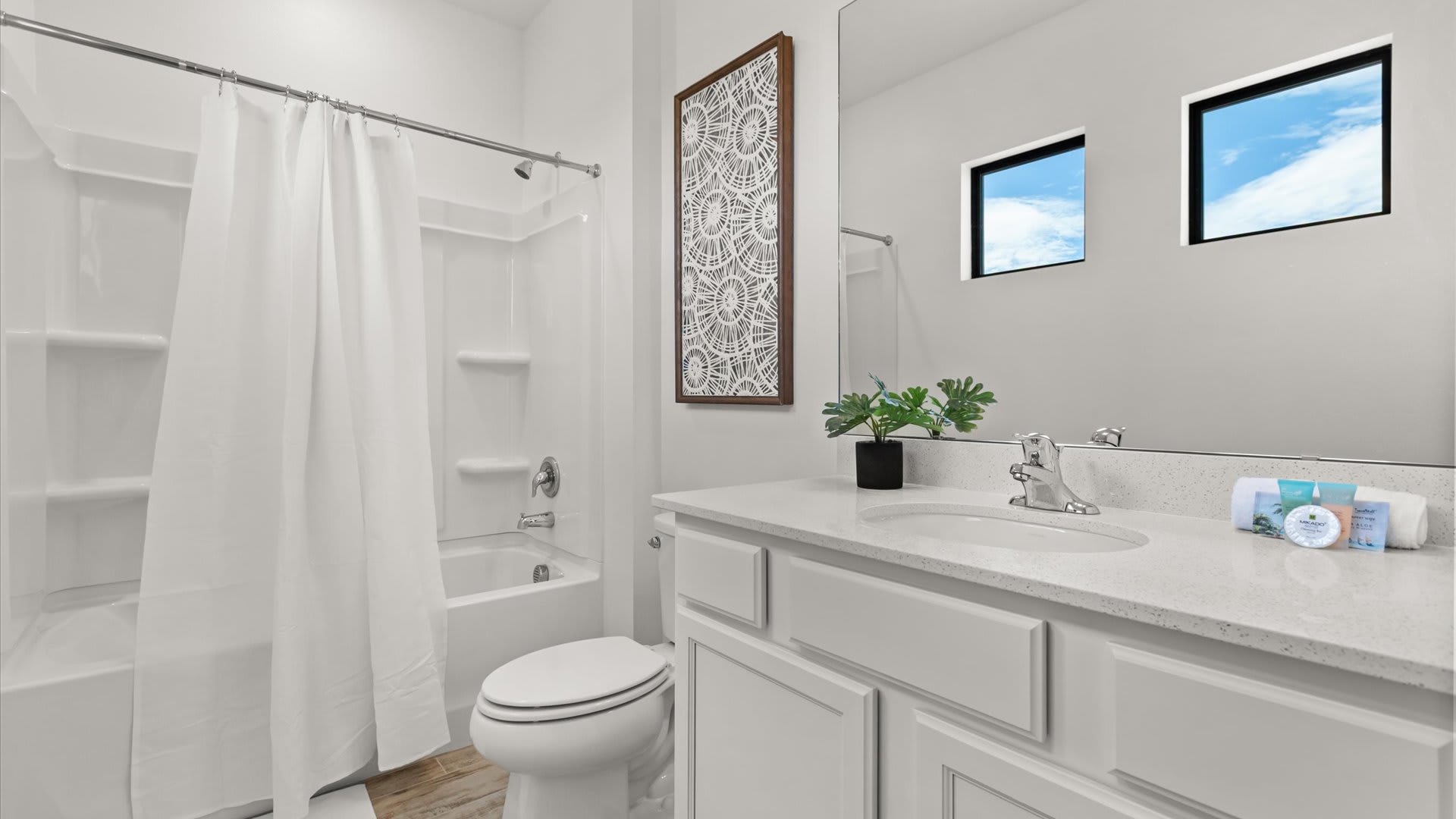 Full bathroom with combined bathtub and shower