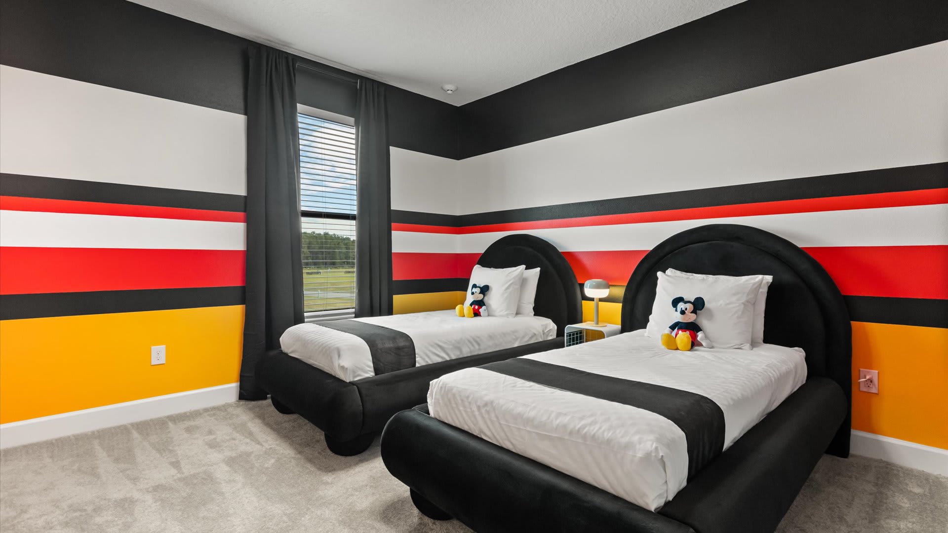 Mickey mouse themed bedroom with 2 single beds