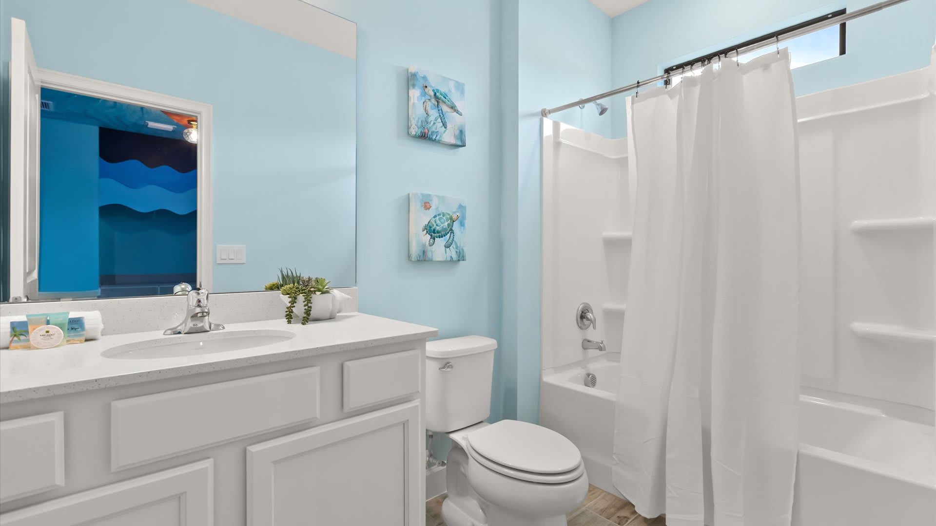 En-suite bathroom with combined bathtub and shower