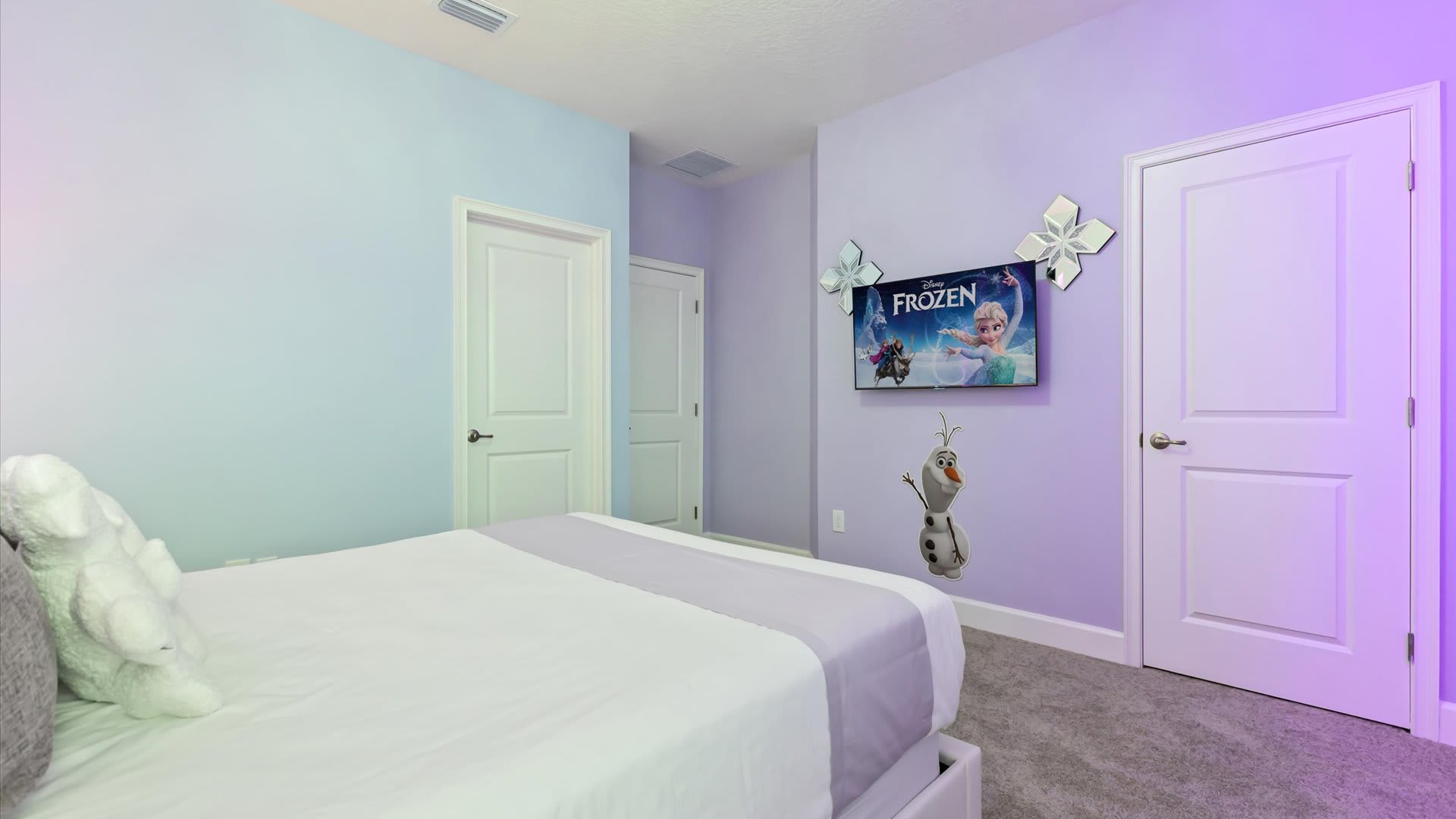 Frozen themed queen bedroom with smart TV