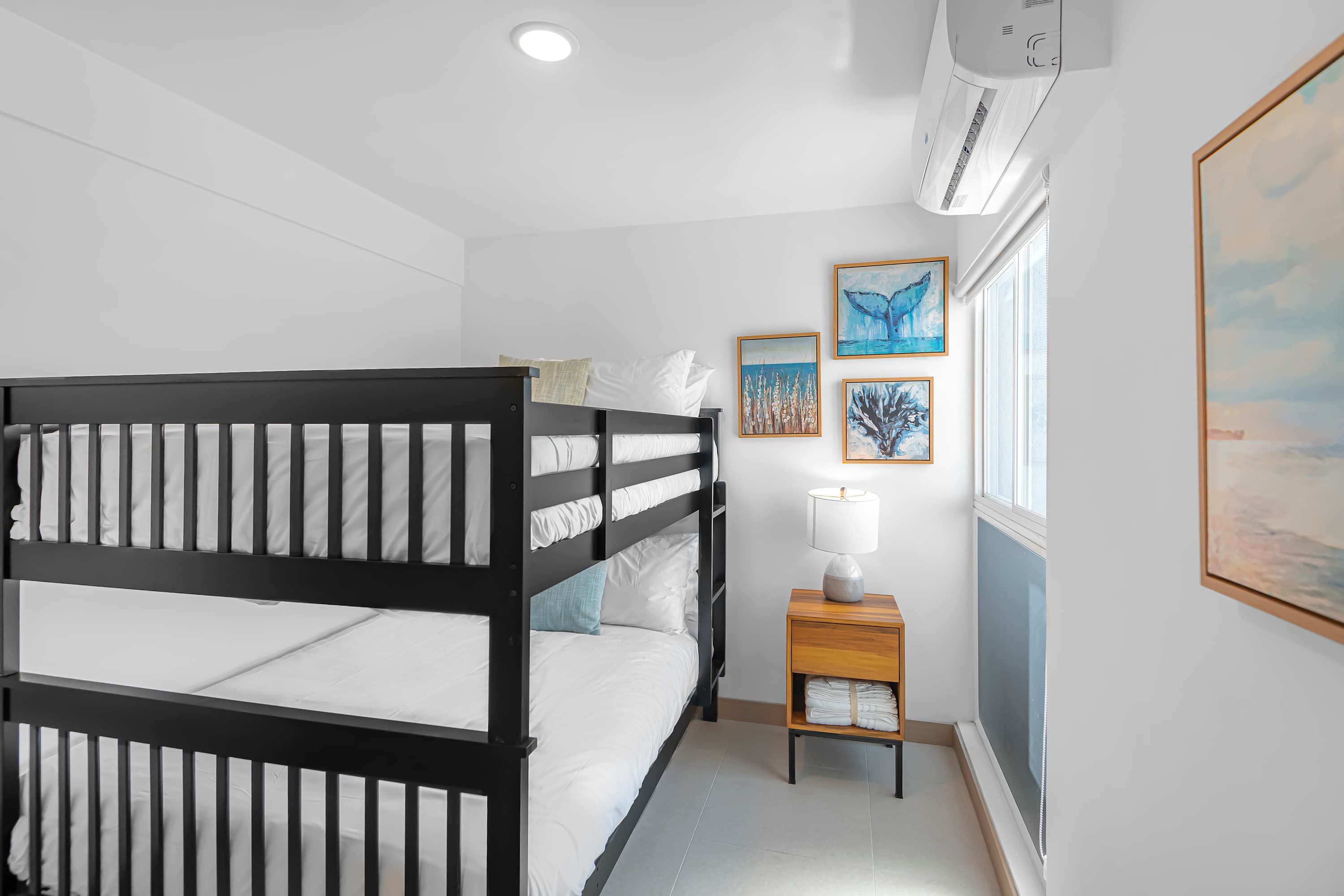 Bunk Beds: Fun and functional, this bunk bed setup is perfect for kids or friends sharing a room.
