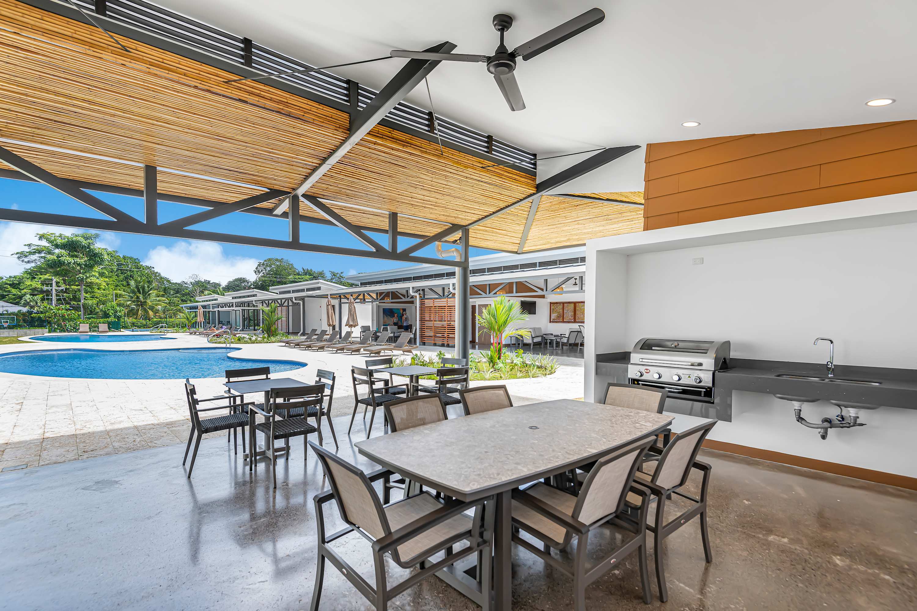 Communal Lounge Area: Open Concept with Pool Table & Seating - A vibrant open-concept lounge designed for connection and fun. Featuring ample seating and a pool and a foosball table. 