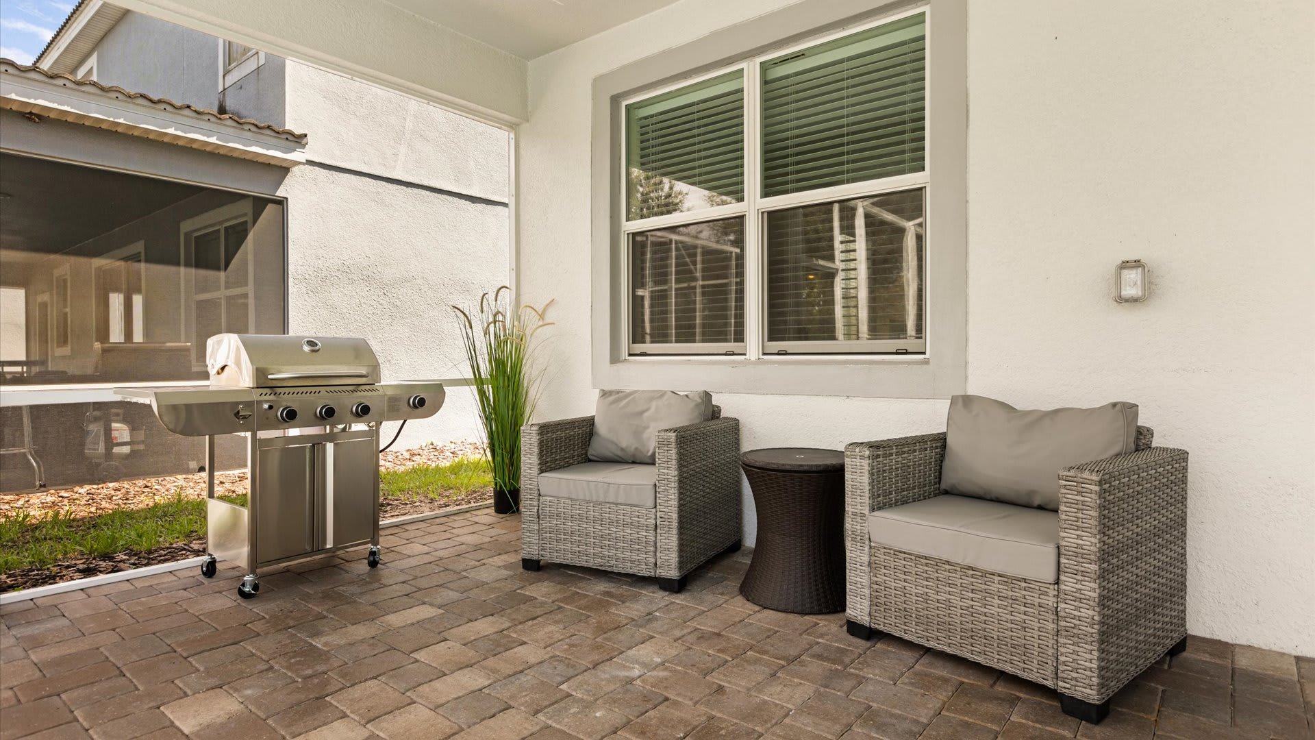 Patio: An inviting space to enjoy al fresco dining or your morning coffee, overlooking the pool and perfect for family gatherings.